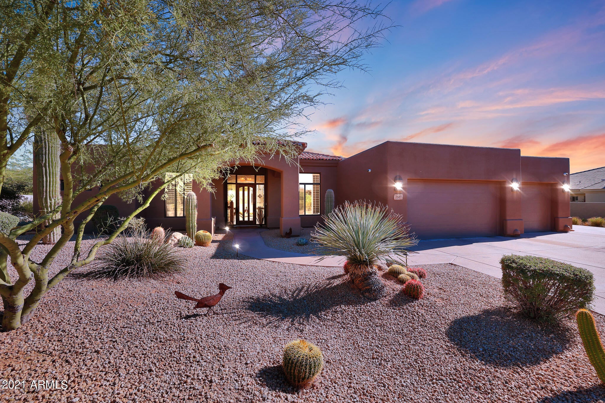 Beautiful Monterra custom home with stunning desert and mountain views of Pinnacle Peak. The 2/3 acre lot is surrounded by natural area open space with resort style living perfect for entertaining. Enjoy the morning sunrise with lush desert landscape. Many exterior upgrades with a kiva fireplace, fire pit, built-in grill, outdoor speakers, and new pool equipment that includes Aqualink Wifi Controls. True 5 bedroom 3.5 bath split floor plan flows perfectly with large picturesque windows allowing tons of natural light. One bedroom was converted to an office with custom cabinets and hardwood floors. The home has ceilings to 12 feet, including 8 foot alder wood doors throughout and many built in features. The large kitchen boasts massive amounts of storage and newer appliances with a Wolf gas cooktop. The family room is upgraded with surround sound and Bluetooth audio video system all conveying. Enhanced Wifi access points allow strong signal throughout the home. The oversized 3 car garage is upgraded with massive amounts of cabinets for storage, workbench, and car lift for 4th car or additional storage. Both AC units were replaced in 2021 with two 5 ton Trane brand units including Nest controlled thermostats. New home security system with 9 outdoor video cameras. Enjoy lower property taxes in Cave Creek School district. Located 5 miles from highway 101 and 8 miles to downtown Cave Creek. This is a rare opportunity!