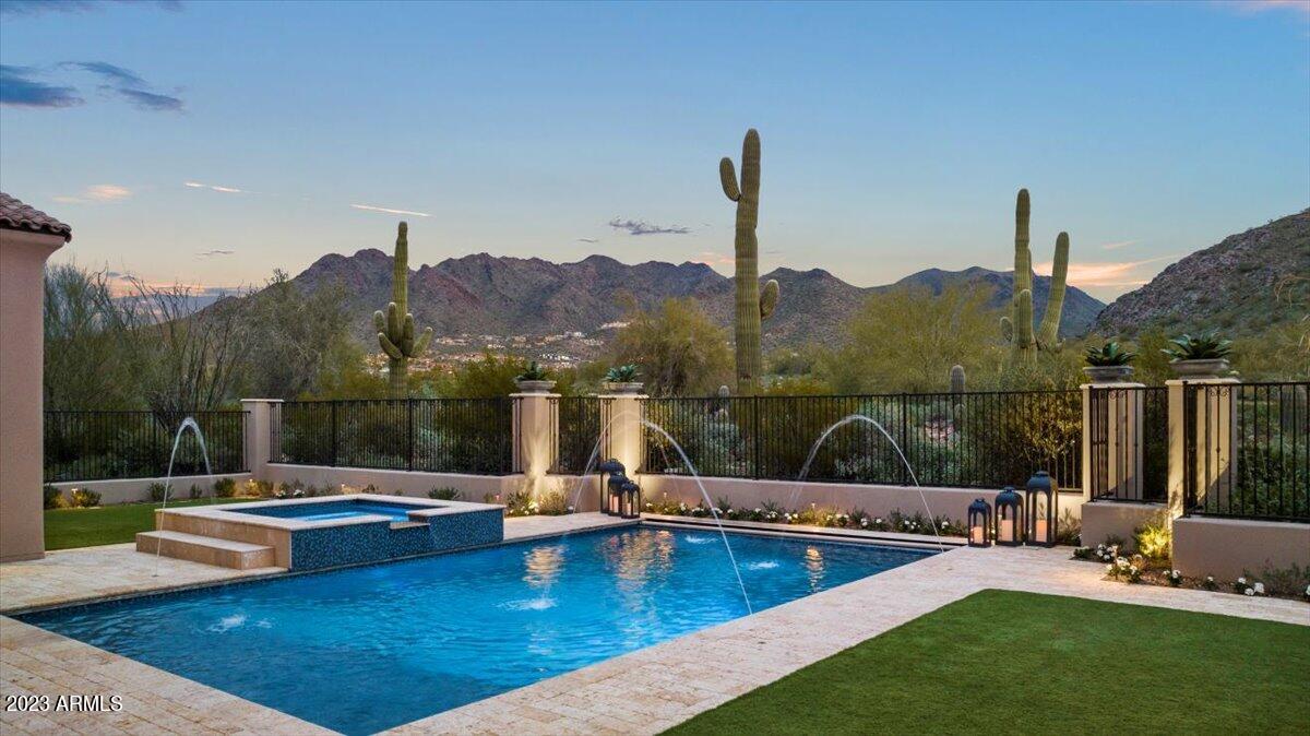 WELCOME TO THE EXCLUSIVE COMMUNITY OF SILVERLEAF! EXQUISITE & IMMACULATE CUSTOM MODERN, LIGHT & BRIGHT ESTATE SITUATED ON SILVERLEAF'S 3RD FAIRWAY OF THE TOM WIESKOPF GOLF COURSE WITH BREATHTAKING MOUNTAIN, GOLF COURSE & CITY LIGHT VIEWS. A RARE OPPORTUNITY TO FIND A CUSTOM HOME LOCATED IN THE HIGHLY COVETED SILVERLEAF PARKS. FEATURING AN OPEN FLOOR PLAN W/8,279 SQUARE FEET, 6 EN SUITE BEDROOMS INCLUDING A CASITA, OFFICE W/BUILT-IN BOOKCASES AND PRIVATE PATIO, BONUS/MEDIA ROOM, 8 BATHROOMS WHICH INCLUDES 2 POWDER BATHS AND A POOL BATHROOM, 2 LAUNDRY ROOMS (DOWNSTAIRS LAUNDRY HAS SERVICE ENTRY), MULTIPLE VERANDAS, 4 CAR-GARAGES W/BI STORAGE CABINETS. SOPHISTICATION, COMFORT, EASY LIVING, ENTERTAINING WITH INDOOR/OUTDOOR LIVING AT IT'S BEST. A GOURMET KITCHEN TO IMPRESS ANY COOK, FEATURING DOUBLE ISLANDS, LARGE WALK-IN PANTRY, SUB-ZERO & VIKING APPLIANCES, 2 DISHWASHERS, 2 MICROWAVES, WARMING DRAWER, BUTLER'S PANTRY W/WINE FRIDGE AND A 336 BOTTLE TEMPERATURE CONTROLLED GLASS WINE WALL. THE LARGE MASTER RETREAT BOASTS A COZY FIREPLACE, HIS/HER CLOSETS, A LARGE MASTER BATH W/HIS/HER WATER CLOSETS, FREE-STANDING SOAKING TUB, FIREPLACE AND FINISHES TO DIE FOR! LIVE OUTDOORS YEAR-ROUND W/THE MOST AMAZING BACKYARD; OUTDOOR KITCHEN, GAS FIREPLACE AND GAS FIRE PIT, HEATED POOL/SPA W/WATER FEATURES, MISTING SYSTEM, CEILING HEATERS, MULTIPLE GRASSY TURF AREAS AND DID I MENTION THE VIEWS! IDEALLY LOCATED TO SHOPPING, SCHOOLS, RESTAURANTS AND THE 101 FREEWAY. THIS IS A MUST SEE, CALL FOR A PRIVATE VIEWING.