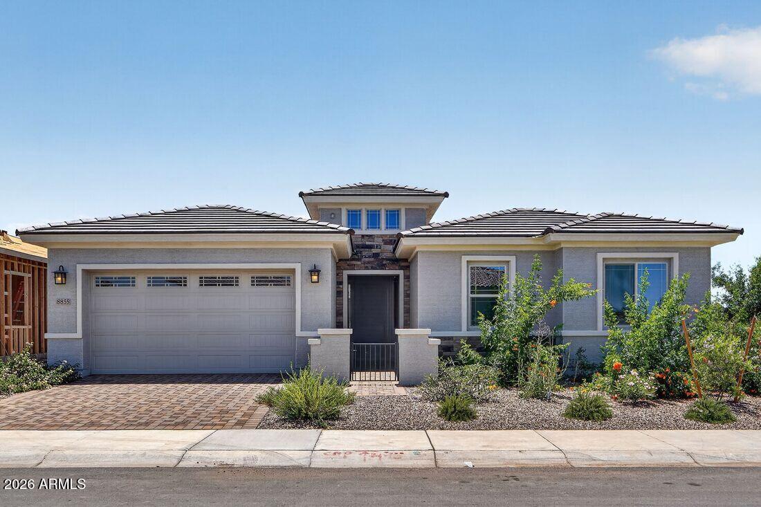 What's Special: Corner Lot | South Facing Patio | Dedicated Study. New Construction - Ready Now! Built by America's Most Trusted Home Builder. Welcome to the Bradshaw at 8855 W Oregon Avenue in Stonehaven Expedition! This amazing home offers 4 bedrooms, 3 baths, a study, formal dining area, and 2,866 square feet of well-designed living space. This open plan feels light and airy from the moment you step inside. The heart of the home is the island kitchen that overlooks the dining area, large great room, and covered outdoor living - the ideal layout for entertaining! The spacious primary suite is tucked away in the back of the home for privacy and features a huge walk-in closet and spa-like bath. Virtually staged photos are for representative purposes only. MLS#6997508 Three secondary bedrooms, a study, a formal dining room, and an oversized laundry room are situated at the front of the home. Experience the best of Glendale at Stonehaven, a master-planned community full of amenities. Enjoy basketball courts, a fun playground, a shimmering pool, and scenic walking trails. Nearby favorites like Top Golf, Chicken N' Pickle, The Sicilian Butcher, Flemings and Desert Diamond Casino make every day easy and fun. Additional Highlights Include: Bedroom 5 with bath 3 in place of tandem, pavers at front porch, garage service door, shower in place of tub/shower at bath 3.