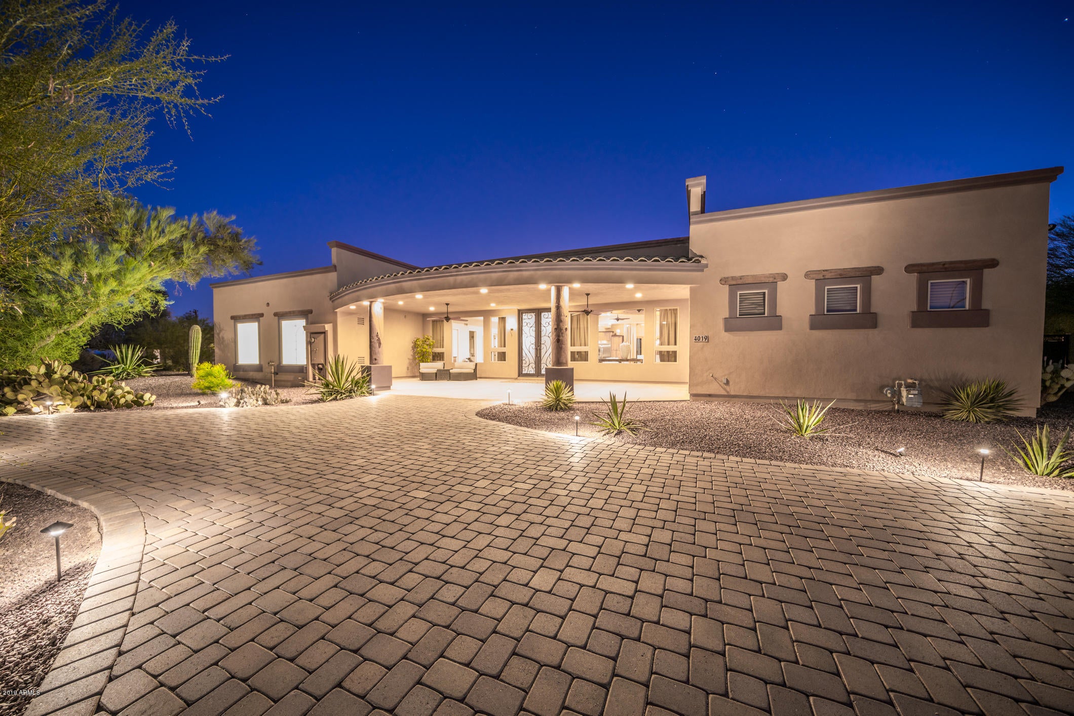 ENTERTAINER'S DREAM, Open Concept Modern Rustic 4 Bedroom Home on a 1.2 Acre lot surrounded by Mountain Views. Step inside the Stunning and Spacious great room of this Custom Designed home with exposed wood beams and brand new White Oak Flooring. The LARGE GOURMET KITCHEN features an 8-burner gas stove, two sinks and two dishwashers - perfect for large gatherings. The LUXURIOUS MASTER SUITE includes a grand walk-in shower, jetted tub, fireplace, and two walk-in closets opening up to a large study or exercise room. Designed for outdoor living, the spectacular backyard has a full Outdoor Kitchen, sparkling Salt Water Pool and Waterfall, observation deck and expansive covered patio.  This property boasts gorgeous landscaping, a circular paved driveway and two RV gates. At the rear of the lot you will find a 5-stall horse stable with tack room, and lighted horse arena. THIS UNIQUE HOME IS A MUST SEE!