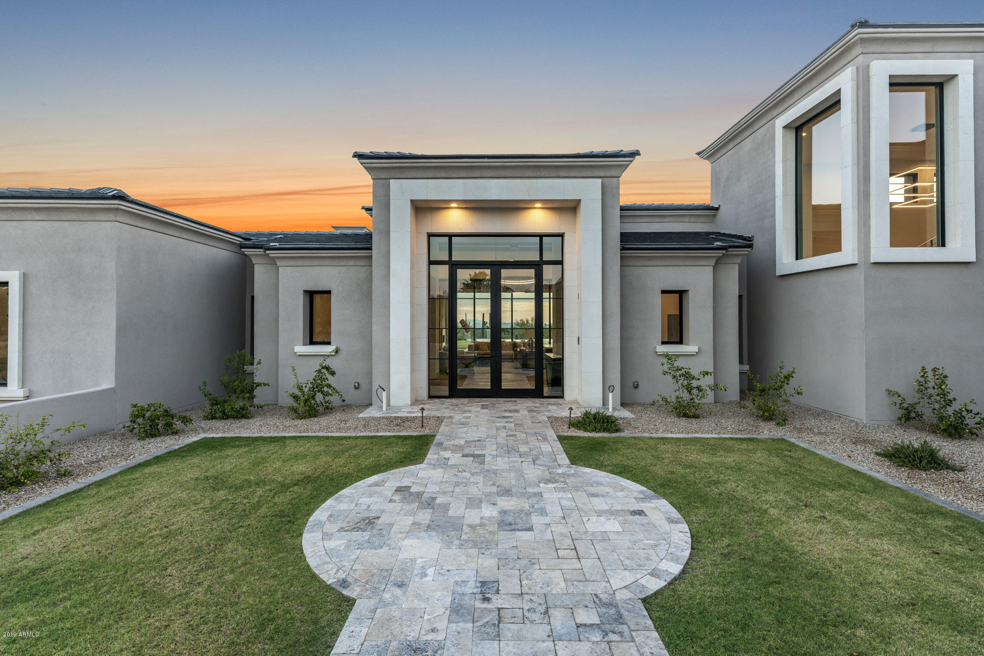 Prado Estates brand new custom estate built by acclaimed luxury home builder Tom Argue. This home has all the elements of transitional living space and contemporary style! Retractable floor to ceiling doors provides views of Camelback, sunsets, and city lights! Five en-suite bedrooms, home theatre, bar, amazing exercise room with outdoor yoga patio. Top of the line appliances, custom cabinetry, and elegant lighting completes this beautiful custom home. Prado Estates is convenient to multiple golf courses, shopping, hiking, and restaurants. The low density requirement gives you privacy and tranquility not found in other communities. We are super excited to tour you through this remarkable custom home!