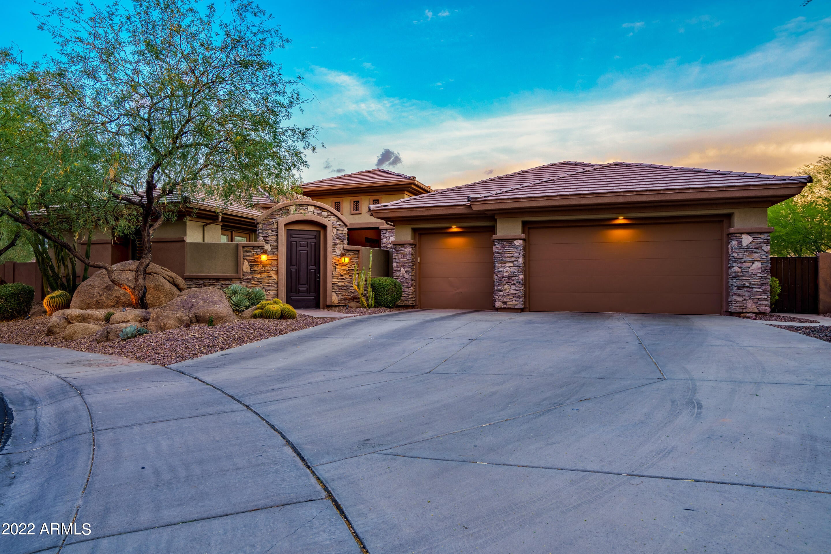 LUXURY RESORT LIVING AT ITS FINEST IN YOUR OWN BACKYARD!! Located in the Anthem Country Club, an exclusive guard-gated community. This amazing home is secluded on a cul-de-sac and sits on a premium half acre lot. The resort-style back yard will leave you breathless! The sparkling pebble-tec pool with an abundance of granite boulders surround. This pool features a two-tiered waterfall, jumping ledge, slide, a rock bridge to cross to the jacuzzi, and will have you enjoying drinks at the swim-up pool bar. The property includes a sunken BBQ area with a fireplace, large rock bench, and an outdoor refrigerator. Enjoy your days playing on the putting green or basketball court, cozying up to the fire pit under the stars, all-the-while being pampered by the ambiance of gas- lit, custom tiki torches and listening to your favorite music on the 3-Zone, surround backyard speaker system. All of this will have you feeling like you're on permanent vacation! Plus pool is equiped with smart phone technology. 

This sought-after Rochester floor plan just can't be beat. As you enter the Soaring 12ft ceilings and travertine floors sets the stage for this beautiful home with the grand living and dining area, the home is surrounded by large windows for ultimate natural light. There is a large office/den to the right as you enter. The split footprint of this home has 6 bedrooms and 4 full and 2 half bathrooms, the left wing offers a Jack and Jill set-up with separate vanity areas and shared shower and toilet area, along with an additional bedroom with a full bathroom right outside. The Right wing offers a grand master with an enormous on- suite, separate soaking tub, a huge doorless, granite tile walk-in shower boasting a glass tile wall, his/ her vanities, and his/her large walk-in closets. A second bedroom with an en-suite, and a large laundry room with built in cabinets finish off the right wing. This property includes an attached 1 bedroom and Half bath Casita for guests with a private entrance. 

The gourmet kitchen features all Monogram appliances, a 6-burner gas stove, double ovens plus a warming drawer, a garbage compactor, separate ice maker, a large refrigerator with cabinet- like panels, walk-in pantry and butler station with a wine refrigerator, granite counter tops with an island/breakfast bar. The kitchen is open to a spacious family room that leads out through the arcadia doors to the back yard oasis making this a perfect home for entertaining. Large 3 car garage with epoxy flooring and lots of storage. This home is surrounded by beautiful mature landscape and luxury synthetic turf.

Anthem Country Club offers the most amazing first-class, resort style amenities that benefit its members. It offers two 18-hole golf courses, 2 pro shops, 2 sets of men's and women's lounges/locker rooms, 2 member restaurants, 2 gyms, 2 pools, 2 spas, several tennis courts, Stunning Ball Room for ongoing Member events and private events, venues available, and 2 guard-gated entrances. Anthem is surrounded by Mountain Preserve views - Did I mention it is 8 to 10 degrees cooler than most Phoenix areas? Trust me when I say you will not want to miss out on this opportunity to own one of the best properties in all of Anthem.