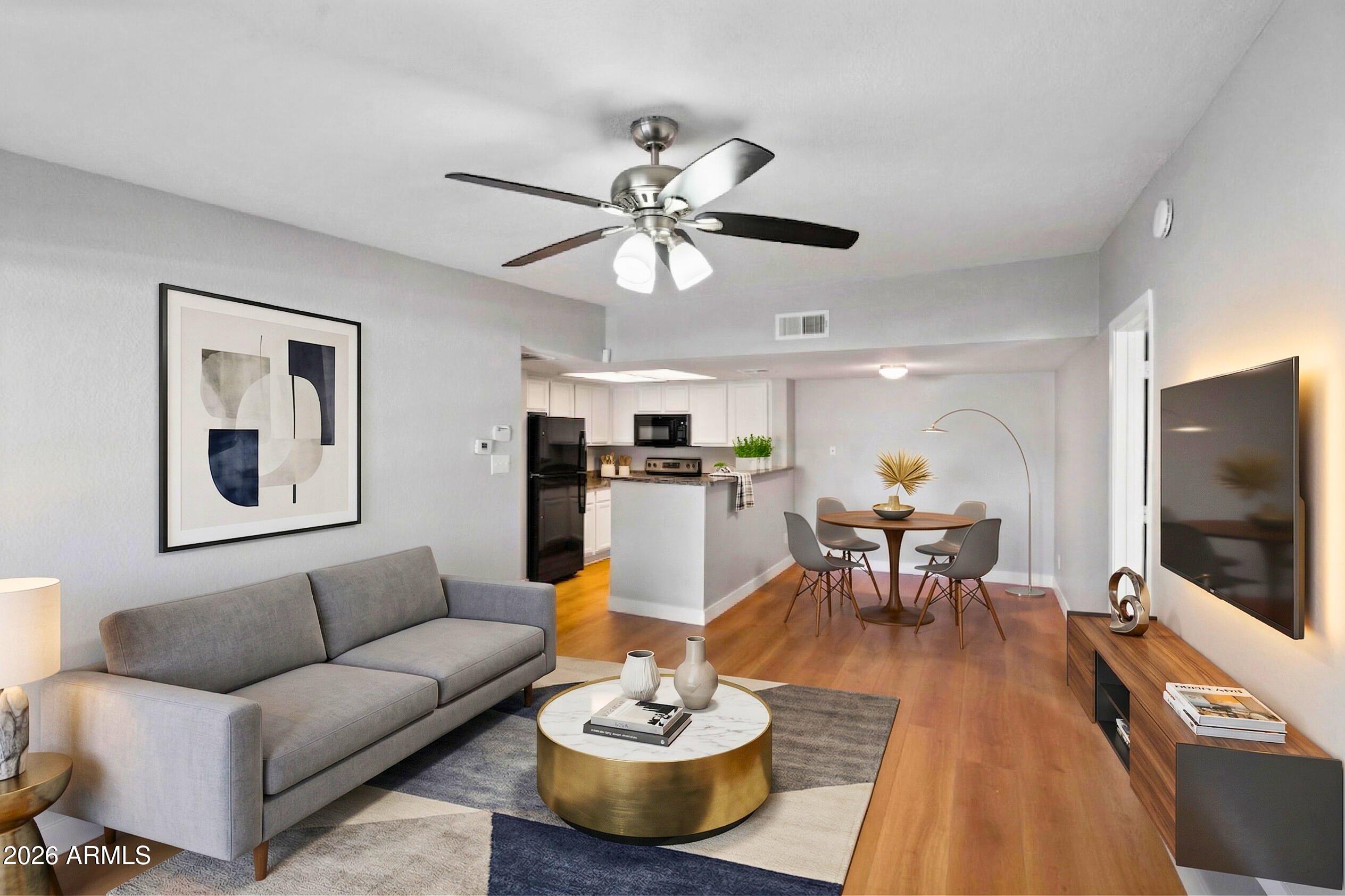 Completely remodeled and truly move-in ready, this stunning 2 bed, 2 bath second-floor condo in Thunderbird Paseo Condominiums offers modern updates, a desirable split floor plan, and exceptional flexibility in a prime Glendale location.

Located directly across from Banner Thunderbird Medical Center, the community allows mid-term rentals, creating a unique opportunity for seasonal residents, traveling medical professionals, or buyers seeking a low-maintenance investment property in a high-demand medical corridor. Whether used as a full-time residence, lock-and-leave winter retreat, or income-producing asset, this condo offers built-in versatility.

Inside, the beautifully updated interior features fresh paint, brand-new laminate flooring throughout, updated appliances, refreshed batht new hardware, modern mirrors, and stylish finishes that create a clean, contemporary feel from the moment you enter.

The spacious living area is filled with natural light from a large sliding glass door that opens to a private patio. The open layout flows seamlessly into the dining area and kitchen, complete with ample cabinet space, updated appliances, and a raised breakfast bar overlooking the main living space, perfect for everyday living and entertaining.

The split floor plan enhances privacy, with a generously sized primary suite featuring dual closets, ceiling fan, and private en-suite bath. The secondary bedroom is positioned on the opposite side of the unit near the hall bath with tub/shower combo.

Thunderbird Paseo offers resort-style amenities including a heated pool and spa, clubhouse with fitness center and lounge areas, billiards room, picnic areas with gas BBQs, mature landscaping, and assigned covered parking.

Excellent Glendale location near ASU West, Thunderbird Paseo Park, shopping, dining, and major freeways, offering convenience, comfort, and long-term value in one of the area's most accessible pockets.