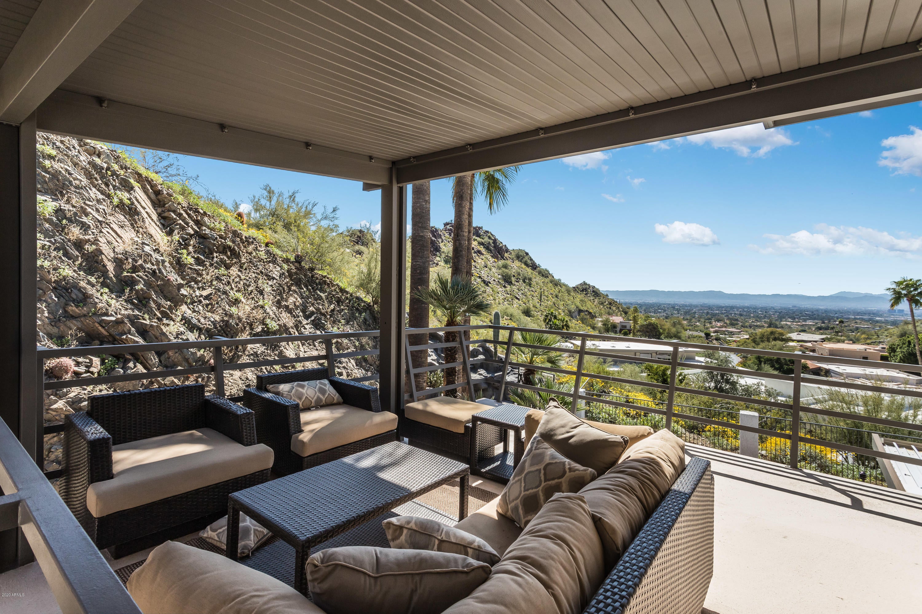 Absolutely stunning Mid-Century Masterpiece with breathtaking views as far as the eye can see. Located in the guard gated community of Lincoln Place this swanky property makes you feel as though you're living in the Hollywood Hills.  Originally built in 1974 and then extensively renovated in 2018 this is truly one of a kind. From the moment you walk through the front door you are met with walls of glass, soaring ceilings and views galore.  Huge living area is separated from the dining room with an iconic 2-way stone fireplace. The kitchen is tastefully remodeled with white cabinets, quartz waterfall countertops and stainless appliances. Sumptuous master has an incredible bath, loads of closet space and an elevator to the downstairs. And the resort style backyard is simply heaven! MUST SEE!