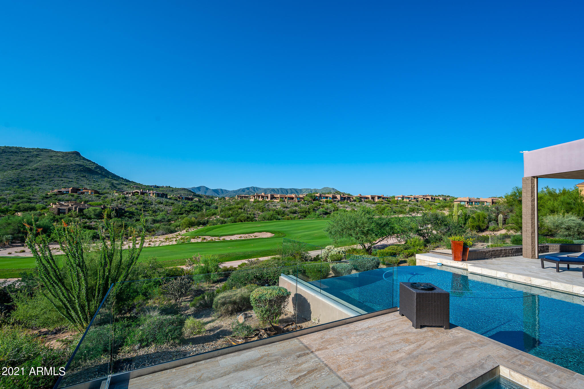 Elegant contemporary home overlooking 18th fairways of the Renegade Golf Course at Desert Mountain in North Scottsdale, AZ. This home is elevated with expansive Valley views, stunning Sunsets, Mountain & City Lights too.  Fabulous home is second-to-non with detailed finishes throughout including polished Limestone floors, Granite Counter Tops, and custom Anigre Etemoe furniture & Makore Cabinets. Telescoping 10' doors open  Living Room to spacious 1800 sq. ft. patio with Pool, Spa, Built-in Wolfe Grill, & Fire Pit. outstanding features include separate guest casita, expansive dual office, spacious sauna, elevator and guest suite has handicap accessible bathroom, 900 bottle wine room, sauna, gourmet kitchen. Desert Mountain Memberships with approval from Club. 24 hour notice to show.