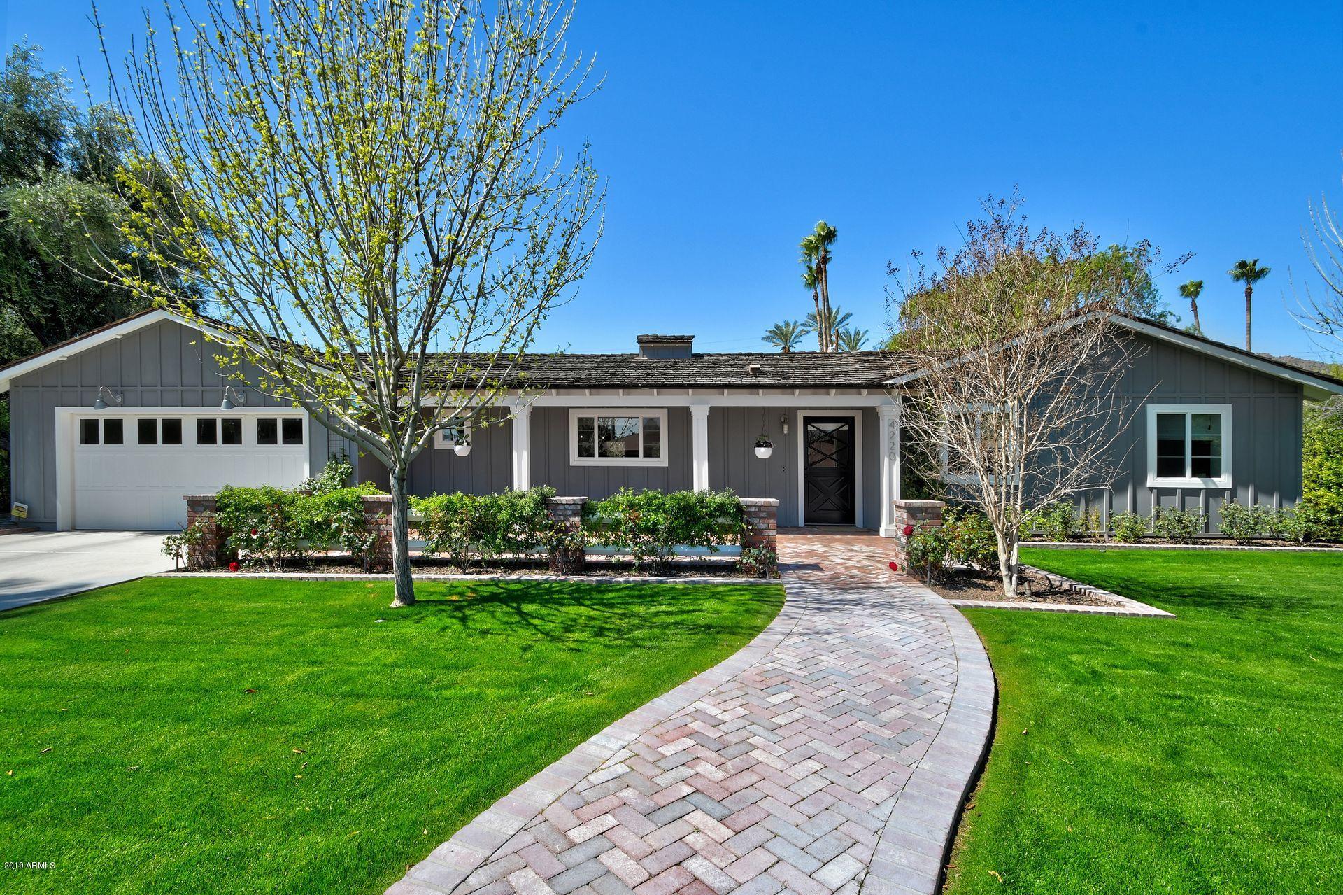 GORGEOUS home located in coveted Arcadia neighborhood just minutes away from Old town Scottsdale on a quiet interior street.  Fully rebuilt by the spectacular K2 Homes!  This transitional ranch home has an open, master split floor plan with large great room in the heart of the home.  Tongue and groove ceilings and ship lapped walls accent the great room, while custom cabinetry, lighting, and vintage inspired appliances grace the gourmet kitchen.  Large master suite featuring custom cement floor tiles, satin finish marble tops and large soaking tub. Other custom features include Provenza Heirloom wide planked wood floors, custom poured concrete counters and separate cooled wine storage.  Large backyard with sparkling pool & spacious covered patio space.  This one will go FAST!