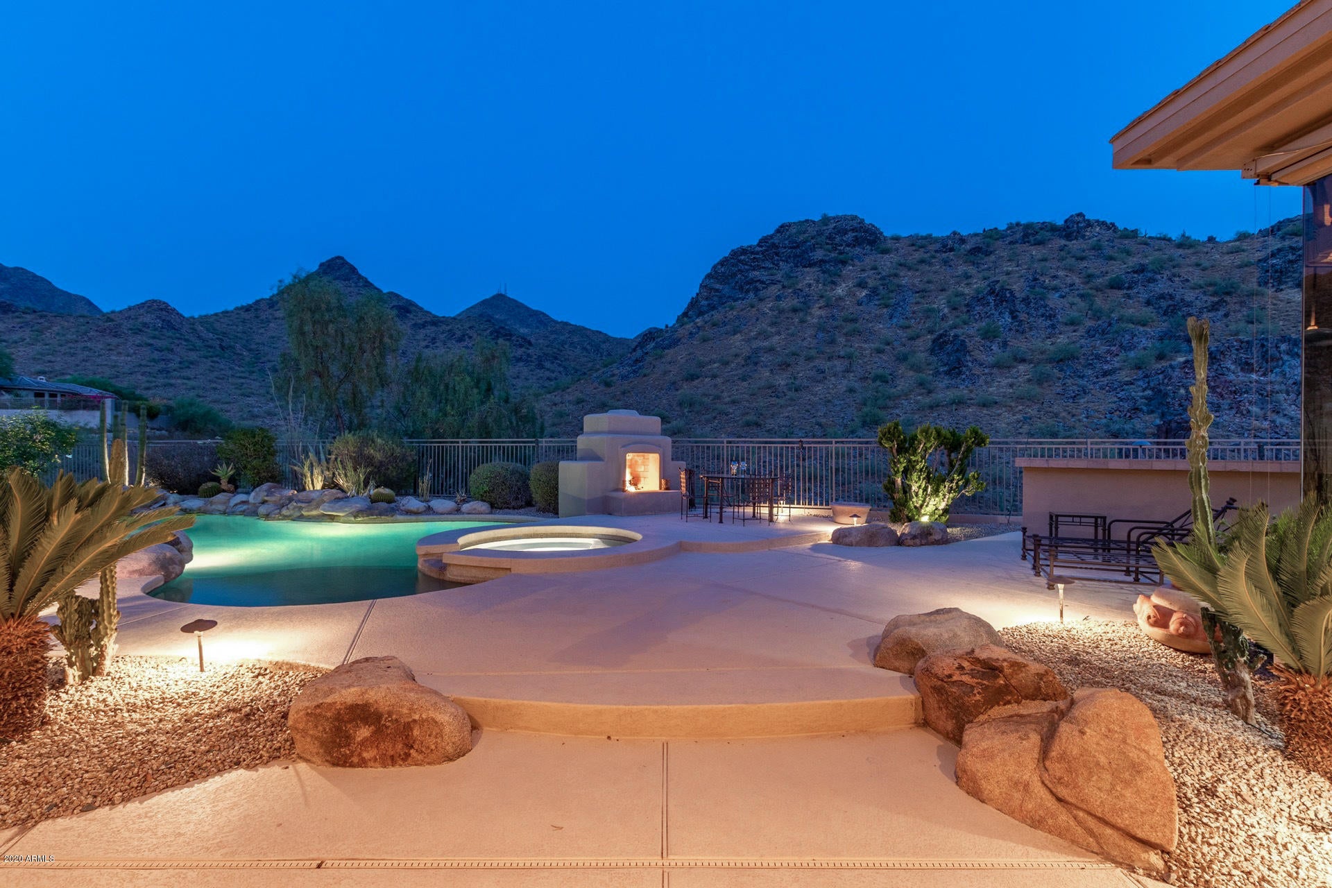 Premium Views!  Executive home perfect for Entertaining & Resort Living.  Backs to Scottsdale Preserve w/Majestic Mountains offering daily stunning views! 3 bedroom/4.5 bath/Den/Office split floor plan offers Elegance and Prestige. Single Level highly upgraded home with Gourmet kitchen featuring Sub-Zero refrigerator, Dacor gas cooking & double ovens, walk-in pantry & more!  Custom upgrades throughout including Surround Sound, Travertine & Hardwood floors.  All bedrooms are ensuites & offer privacy! Backyard is an oasis with breath taking views! Large covered patio, Pebble-Tec pool & spa, Misters, BBQ, & fireplace.  Minutes to Barrett Jackson, PHX Open, world class shopping, golf, dining, entertainment & so much more! A winning combination of luxury & location! This is a must see!