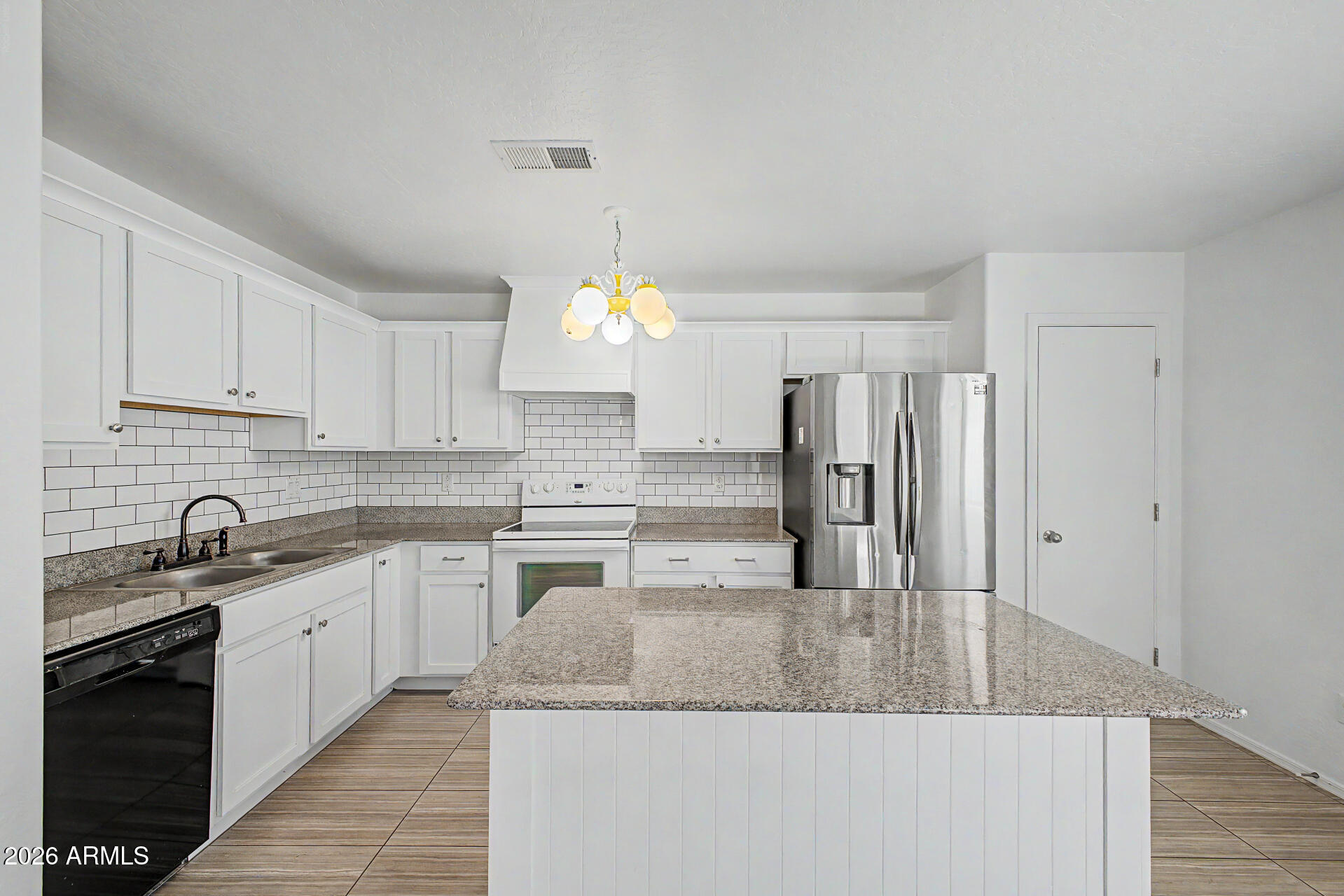 Welcome to the peaceful Community of Stagecoach Trails, where this charming single-level home awaits you! Providing 2 beds, 2 baths, a 2-car garage, and a mature landscape. The inviting interior showcases a neutral palette, abundant natural light, and tile & wood-look flooring throughout. You'll love the seamlessly flowing living & dining room! The impressive kitchen boasts built-in appliances, granite counters, a subway tile backsplash, a pantry, white shaker cabinetry w/crown molding, and an island w/breakfast bar. Each bedroom includes a walk-in closet! The large primary bedroom also has a full bathroom for added comfort. The private backyard, with an extended paver-covered patio & artificial turf, is the ideal spot to relax or enjoy BBQ. Excellent location! Don't miss this opportunity!