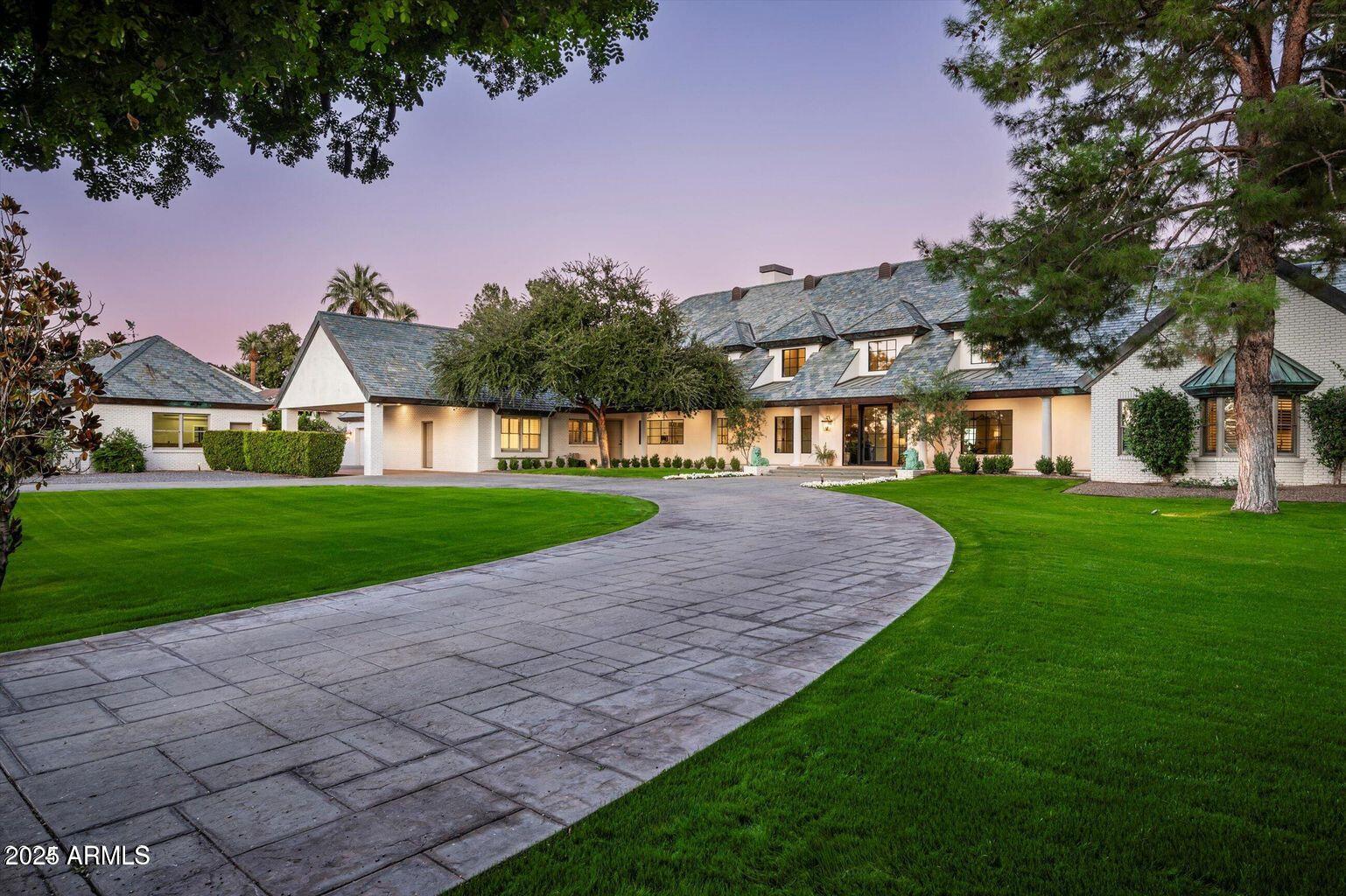 This private gated estate has been remodeled with exquisite taste. Sitting on the world renown Arizona Biltmore Circle with magnificent golf course and mountain views, it's a home most can only dream of. The open floor plan has views from every vantage point showering each room in natural sunlight. Architectural excellence, high end finishes, and a perfect combination of elegance and comfort combine perfectly to create impressive living spaces. In addition to the exceptional kitchen with a butler's pantry, there's a beautiful great room and den, a home gym that could double as an art studio or a playroom, both formal and informal dining rooms, and a very pretty primary suite with exquisite panoramic views. Positioned between two fairways, the grounds are so special featuring a lovely... pool, covered patio and meandering deck with room for large scale entertaining. To top it off, there's a seven-car garage for the resident car enthusiast. This is a wonderful home sitting in an iconic area that offers an unbelievable lifestyle!