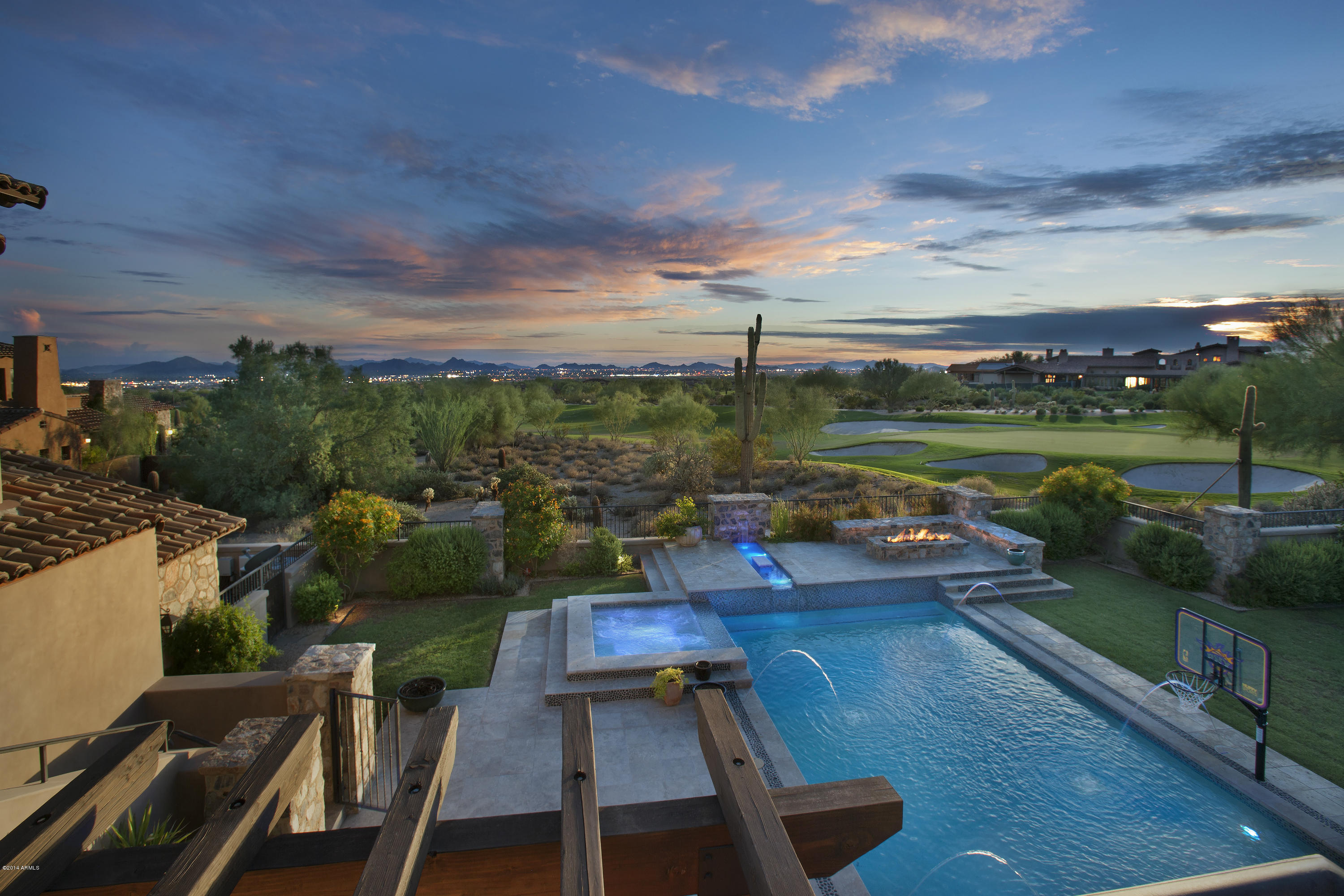 Rare Opportunity to own one of the BEST VIEWS in DC Ranch- with Golf course, Mountain, Sunset and brillant City light views. This 7 Bedroom plus office custom home built in 2011 by Archer Custom Homes has not only the quality custom finishes we are all looking for, but also a perfect livable floorplan - large double island kitchen opening to a beautiful great room, leading out to spacious outdoor entertaining areas, outdoor kitchen and large grassy yard.
The game/media room and guest quarters enhance both family living and entertaining. You don't want to miss this one... IT IS  STUNNING- inside and out.