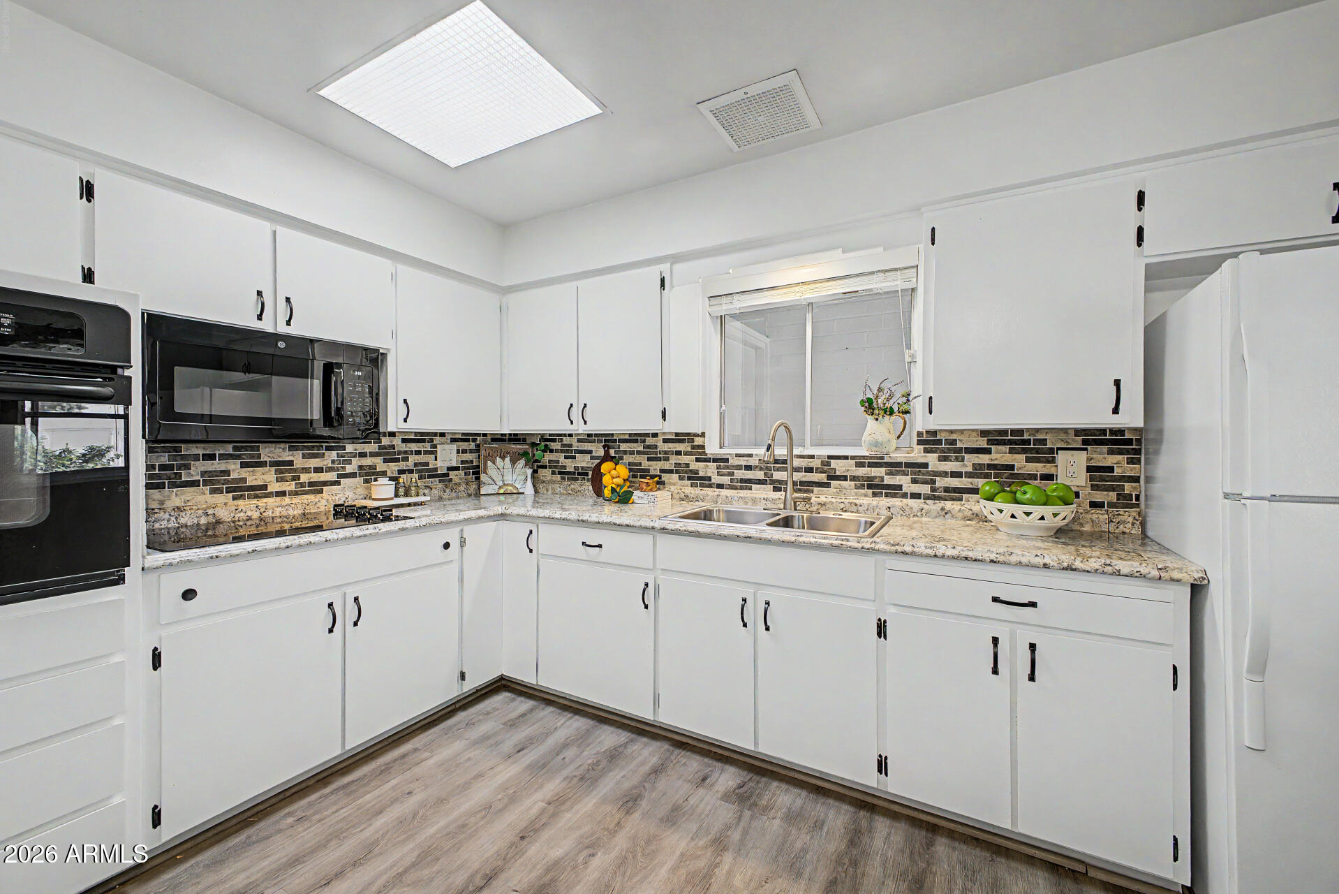 Enjoy the privacy you expect and deserve with this home in Dreamland Villa,  offering a BRAND NEW block-fenced backyard--perfect for relaxing or entertaining. The charming kitchen was just refreshed with white cabintes and all newer appliances, ceiling fan, & the fridge is included.  Major updates provide peace of mind, including a newer roof (2016), HVAC (2023), water heater (2026), and dual pane windows, helping you avoid costly repairs for years to come. From the moment you arrive, you'll love the inviting south-facing front patio with ample seating space to enjoy your morning coffee or afternoon tea. Step inside to seamless luxury plank flooring that flows beautifully throughout the home. The bathrooms have been tastefully remodeled with today's modern finishes and amenities. Ideally located near shopping, dining, hospitals, and convenient freeway access, this home combines comfort, style, and an unbeatable location.