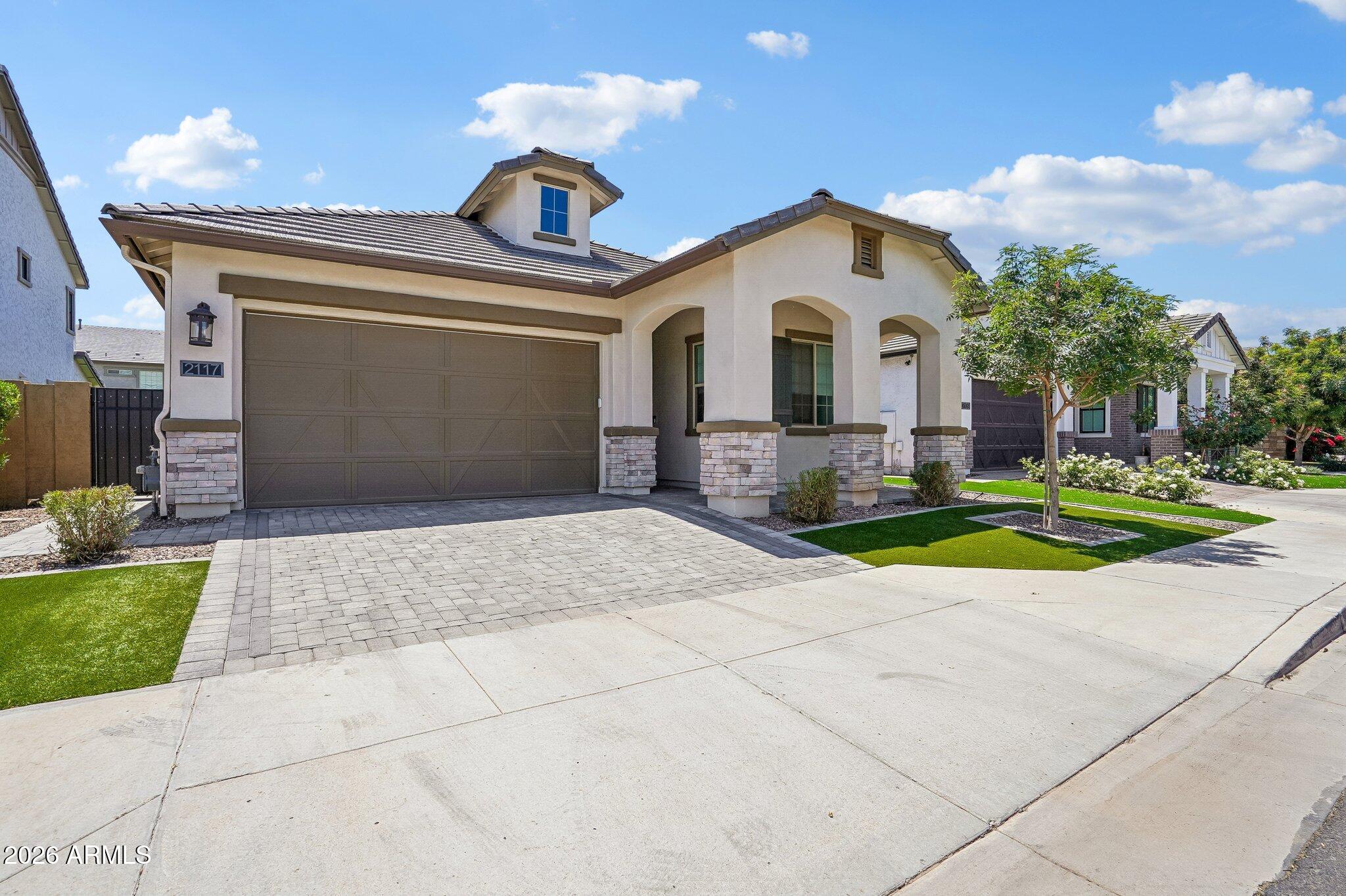 Located in the highly sought-after gated community of Stratford, this beautifully upgraded single-story home offers the perfect blend of modern design, comfort, and location in the heart of Gilbert. Featuring 4 bedrooms, 3 full bathrooms, and a spacious 3-car garage complete with an electric vehicle charger, this home was thoughtfully designed for both everyday living and effortless entertaining.

Inside, you'll find an open-concept floorplan filled with natural light, contemporary finishes, and seamless flow throughout the main living spaces. The beautifully appointed kitchen opens to the great room and dining area, creating an inviting atmosphere ideal for gatherings both large and small. The spacious primary suite offers a peaceful retreat, while the additional bedrooms provide flexibility for guests, a home office with custom built-in closet, fitness space, or growing households.

Step outside to enjoy the private backyard and Arizona lifestyle year-round. Beyond the home itself, Stratford is one of Gilbert's most desirable gated communities, known for its beautifully maintained grounds and incredible neighborhood amenities. Residents enjoy inviting community gathering spaces including cozy fire pits, playgrounds, BBQ pavilions, greenbelts, and open spaces that create a true sense of community.

Ideally located just minutes from Downtown Gilbert's vibrant dining, shopping, entertainment, and nightlife, this home also offers convenient access to top-rated schools, parks, and major freeway connections. A rare opportunity to own a move-in-ready home in one of Gilbert's highly desired gated neighborhoods.