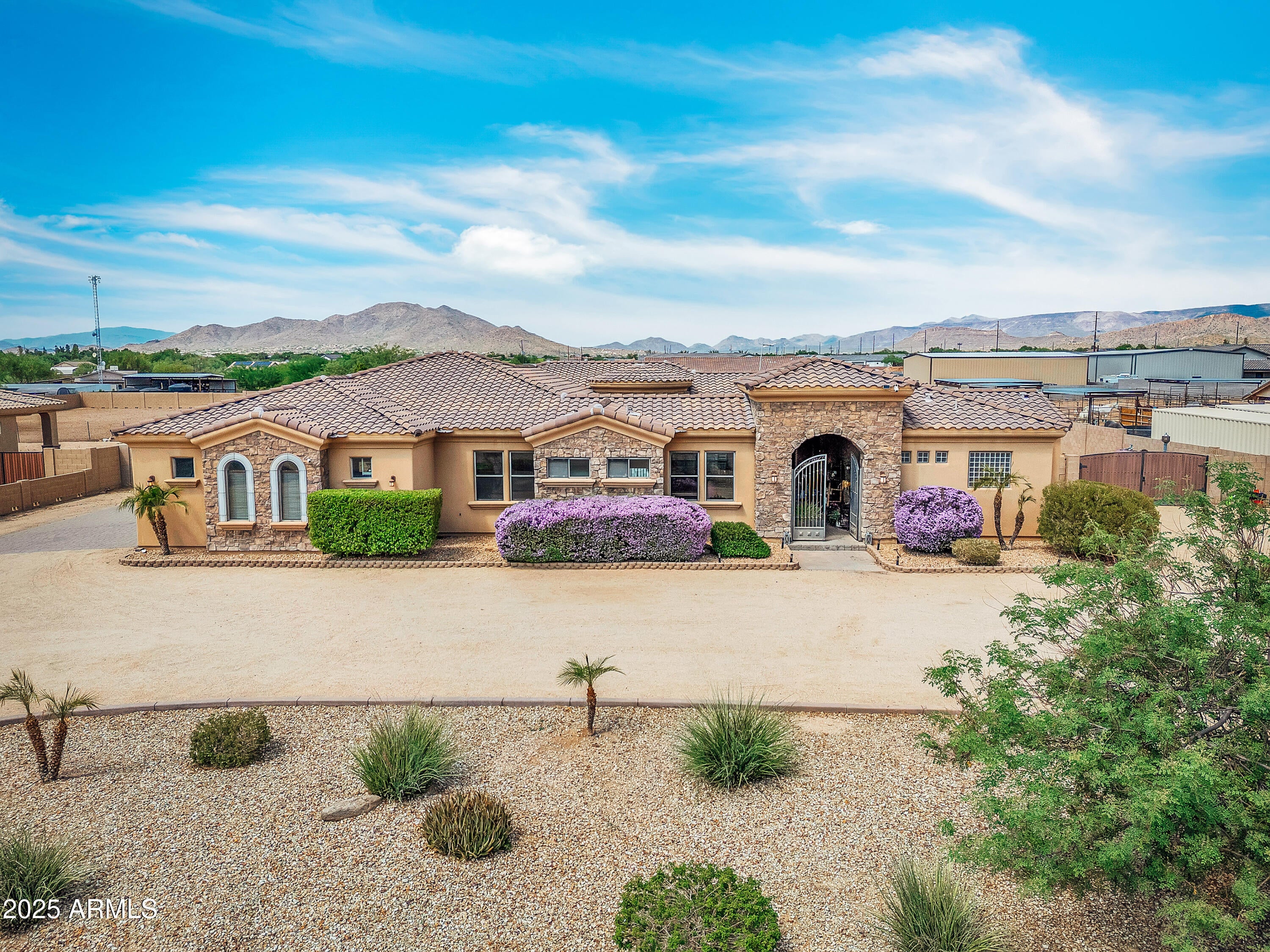 Exceptional equestrian property in the highly sought-after community of Desert Hills, offering two parcels and endless possibilities. The main residence spans 3,584 square feet on 1.14 acres and showcases a bright, open floorplan with a spacious family room seamlessly connected to the kitchen, perfect for entertaining. Each bedroom features a walk-in closet, while the outdoor living space includes a sparkling pool, covered patio, and equestrian amenities. 
This property provides remarkable versatility.