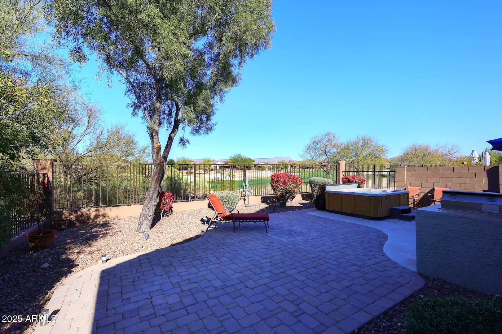 WOW, Nothing like this location on the golf course at this great price! This lovely home  features  3 bedrooms, 2 baths and is  located on the 6th hole of the Ironwood Golf Course in Anthem Country Club. The open Great Room and dining area feature hardwood floors and  opens  to an extended paver patio with built-in BBQ and hot tub, overlooking golf course and awesome mountain views. The light and bright kitchen includes stainless steel appliances, pantry, and breakfast bar. The spacious primary bedroom has Two closets. The second bedroom or office features a Murphy bed.  A  split third bedroom for added privacy. Plantation shutters and ceiling fans throughout. Laundry room includes utility sink, washer, and dryer. Enjoy resort-style amenities at the Anthem Community Center and Country Club
