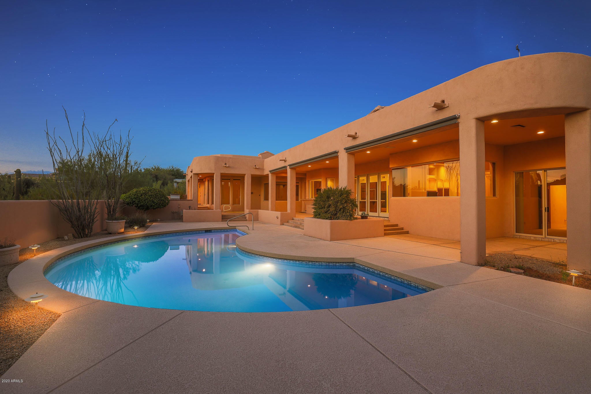 Unique opportunity to make this Windy Walk at Troon Village home your own! THE LISTING INCLUDES THE LOT DIRECTLY BEHIND THE PROPERTY to preserve the Pinnacle Peak views and maintain the private feel. The timeless open concept floor plan has all the makings of a modern setting perfect for entertaining including a great room with wet bar, formal dining space, kitchen with breakfast nook, and a grand foyer entry. Views of famous Pinnacle Peak from almost every room out the back and Troon Mountain views out the front! The master suite has a fireplace - one of three in the home - and exterior access along with an entry into the private office (could be used as a second walk-in closet or exercise/wellness room!) through the master bath. The split room floorpan features the additional three guest rooms on the other wing, one being and en suite and the other two sharing a jack-and-jill bath, all with walk-in closets. The backyard has commanding views with a large covered patio extending the length of the home, spa, unique shaped pool, and room to add-on for someone to make their dream backyard come true. Windy Walk in Troon Village is a 24-hour guard gated community, home to Troon Country Club's private golf course. This home is within walking distance to the course and the recently renovated Troon clubhouse. Don't miss this opportunity!