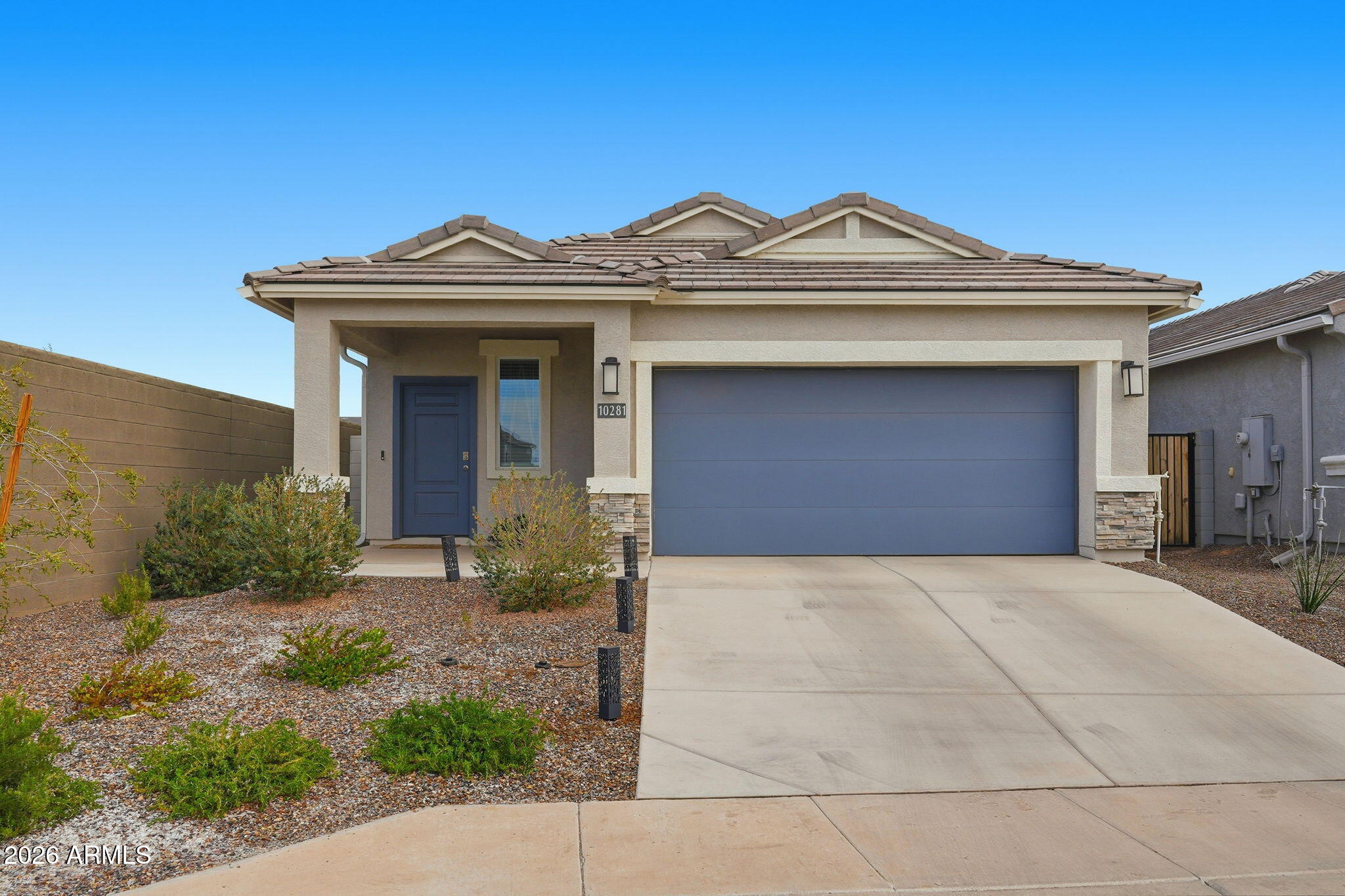 Welcome to this well-designed energy efficient Caroline floor plan offering 3 bedrooms, 2 bathrooms, and 1,545 sq ft of open-concept living. The kitchen features stainless steel appliances, granite countertops, and a center island, while large windows in the great room provide abundant natural light. The split floor plan offers a private primary suite with an en-suite bath including dual vanities, a walk-in shower, and a spacious walk-in closet. Two additional bedrooms provide flexibility for children, guests, or a home office and share a secondary bath with dual sinks and a shower/tub combination, covered patio. Radiance Community amenities include a community pool, splash pad, clubhouse, fitness center, grilling areas, fire pits, basketball and bocce courts, and an extensive trail system. Convenient access to US 60 and State Route 24.