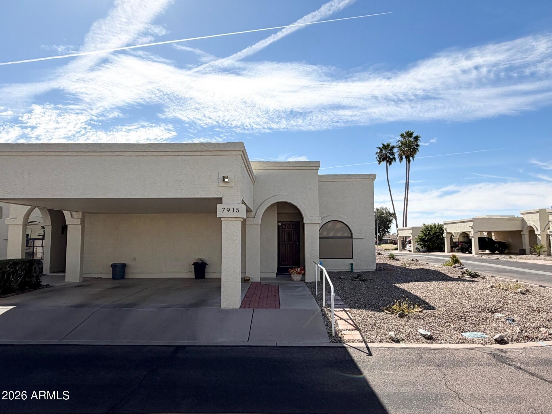Welcome to easy, lock-and-leave living in the heart of Fountain of the Sun, East Mesa's premier 55+ guarded and gated golf community. This End Unit condo offers 2 Bedroom, 2 Bath and 1 Car Carport, Step inside to a welcoming great room with abundant natural light and a seamless flow into the dining area and kitchen. The kitchen provides plenty of cabinet space, a functional layout, The primary suite offers generous space, a walk-in closet, and an en-suite bath, while the guest bedroom is ideal for visitors or a hobby room. Roof (2018), Heat Pump (2021), Water Heater (2021), Exterior Painted (2025), Enjoy Arizona's beautiful weather from your private patio, perfect for morning coffee or relaxing after a round of golf. Living in Fountain of the Sun means access to resort-style amenities.