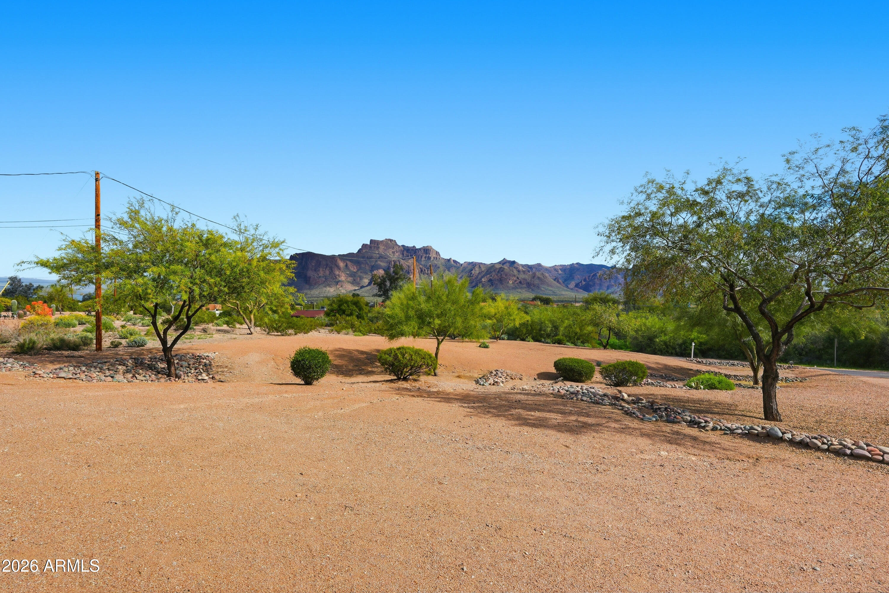 VIEWS, VIEWS, VIEWS.  This custom home was all updated and redone in 2014.  Very Open Floor Plan with split Bedrooms. Granite counter tops in Kitchen and Baths.  Travertine Tile throughout Home with Carpet in Bedrooms. 2 HVAC's replaced 2022. Roof was redone 2022. Outside painted in 2023. 2nd Shower and Ceilings on both Front and Back Patios were replaced in the last 3-4 years.  Water Heater and House Shut off Value replaced 2025.  50 Amp Hook-up for RV's.  Plenty of Extra Space on Lot for Toys, Horse Stall, Pool or Work Shop.  12 Ft Ceilings.