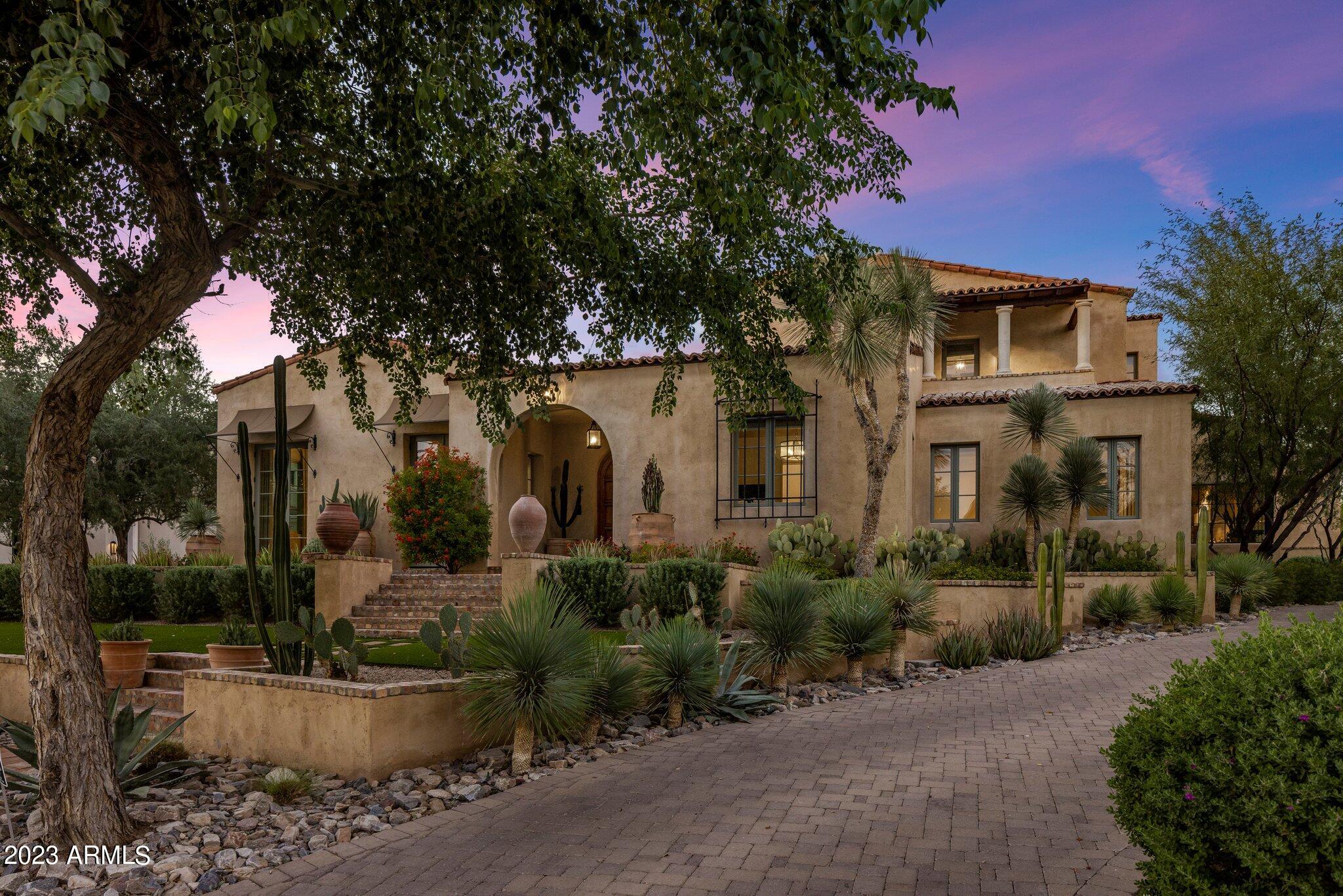 Nestled in the coveted Arcadia neighborhood of Silverleaf, this spacious 6,047 square foot 4-bedroom, 4.5-bath estate, was designed by architect Gene Kniaz of the Spiral Group and built by renowned builder Eric Linthicum of Linthicum Custom Builders. With its hand-formed roof tile, rustic brick, and exquisite stucco exterior featuring three-coat plaster, this home exudes a blend of craftsmanship and old-world charm.

Inside, accentuated by the white oak floors and beam ceilings, the large, glazed windows flood the living spaces with natural light, creating a tranquil and airy ambiance. The large formal living area features a stunning fireplace, while a separate formal dining room provides an elegant setting for special occasions.

The heart of the home, the large dine-in kitchen .... offers a spacious kitchen island, professional-grade appliances, and elegant leathered granite countertops. A generously sized butler's pantry, complete with a refrigerator, dishwasher, and separate ice maker, adds convenience to your daily life.

The principal suite, with a dual-access closet, opens to a private courtyard, creating a spa-like retreat with an indoor-outdoor patio and shower. The timeless design elements throughout the home, such as the guest casita with a Murphy bed and full bathroom, ensure your comfort and style. 

Outside, landscape architect Steve Martino has created a lush and romantic resort-style oasis. A heated pool and spa, along with an outdoor kitchen equipped with a refrigerator and sink, ensure a perfect outdoor entertainment space. Both the front and back yards feature low-maintenance synthetic grass.

Backing to the Reata Wash this serene estate offers privacy and a sophisticated, understated luxury that harmoniously blends old-world charm with modern amenities.