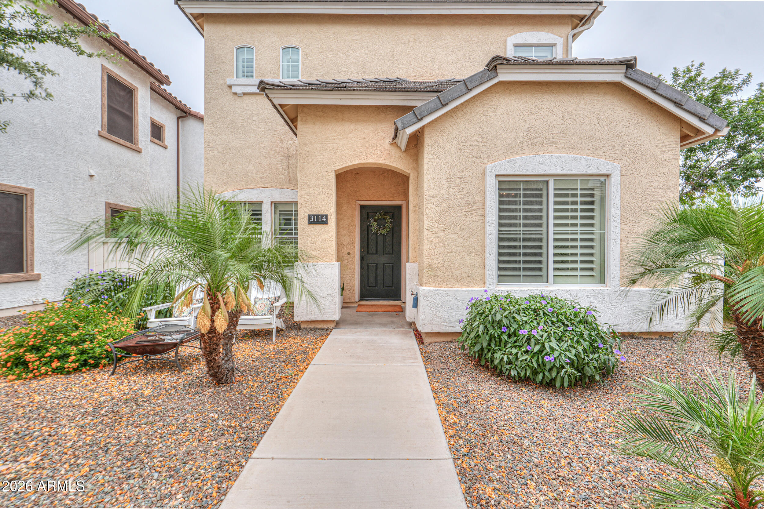 Welcome to Agritopia, where everyday living feels a little more connected and a lot more enjoyable.  Set within one of Gilbert's most sought after communities, this home offers a balance of comfort, style, and the kind of neighborhood atmosphere that is hard to find. 
Mornings begin with a walk along tree lined streets, evenings bring neighbors together, and everything you need is just a short stroll away.  
Inside, the home is both functional and inviting with nearly 1,800 sqft, four bedrooms, and two and a half baths. The layout offers both a living room and a separate family room, creating space to gather as well as room to unwind. Thoughtful updates throughout give the home a clean, modern feel, including wood plank tile floors, neutral paint, wood shutters, and updated finishes. The kitchen was designed to be the center of the home, featuring white shaker cabinetry with crown molding, granite countertops, a subway tile backsplash, and a large breakfast bar. Stainless steel appliances, including a commercial size refrigerator, along with added touches like a pot filler and butcher block workspace, make it as practical as it is stylish.

Upstairs, the primary suite offers a comfortable retreat with a walk in closet, an ensuite bath, and dual sinks. Additional bedrooms provide flexibility for guests, a home office, or growing needs.  Beyond the home itself, life in Agritopia is what truly sets this property apart. Residents enjoy access to a community pool, tennis courts, fitness center, clubhouse, playgrounds, and scenic walking and biking paths . The setting encourages time outdoors and makes it easy to stay active and connected.  
Just steps away, local favorites like Joe's Farm Grill, Buck & Rider, The Coffee Shop, and Barnone bring a unique energy to the neighborhood. Whether it is meeting friends for coffee, enjoying a casual meal, or exploring local shops, there is a sense of convenience and community that makes daily life feel effortless.  Owning here means more than having a place to live. It means being part of a neighborhood where people know each other, where everything is close by, and where home extends well beyond your front door.