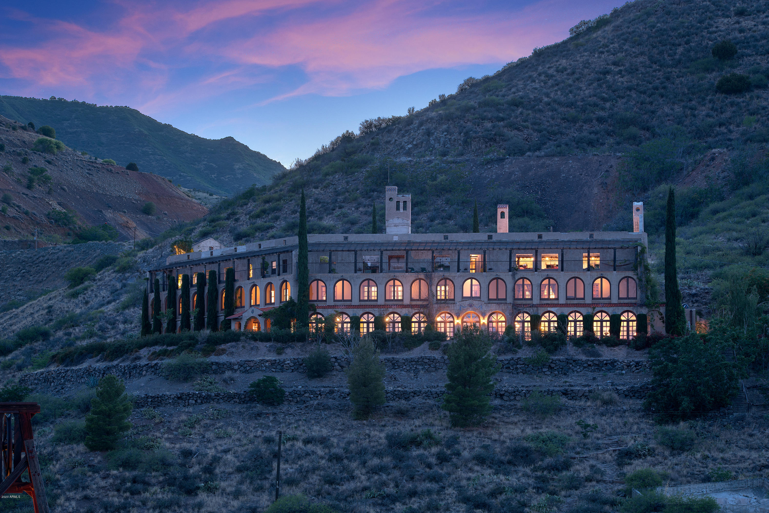AUCTION: Previously Offered for $5.9M. No Reserve. In ruin since the 1950s, the Little Daisy was purchased in 1995 and lovingly put back together over 12 years. Thoughtfully-redesigned as a family estate, the property pays homage to the original structure. Coffered ceilings, the reconstructed reception desk, the kitchen's original metal range hood & antique copper sink take you back in time. 8 reconfigured bedrooms including a grand master suite await you. Walls of French doors grace the main level and arched windows line almost 3,000 square feet of upstairs verandahs. Panoramic views of Sedona Red Rocks and the entire Verde Valley will delight you from the rooftop garden, deck, and outdoor entertaining area, ideal for the picture-perfect southwestern escape.