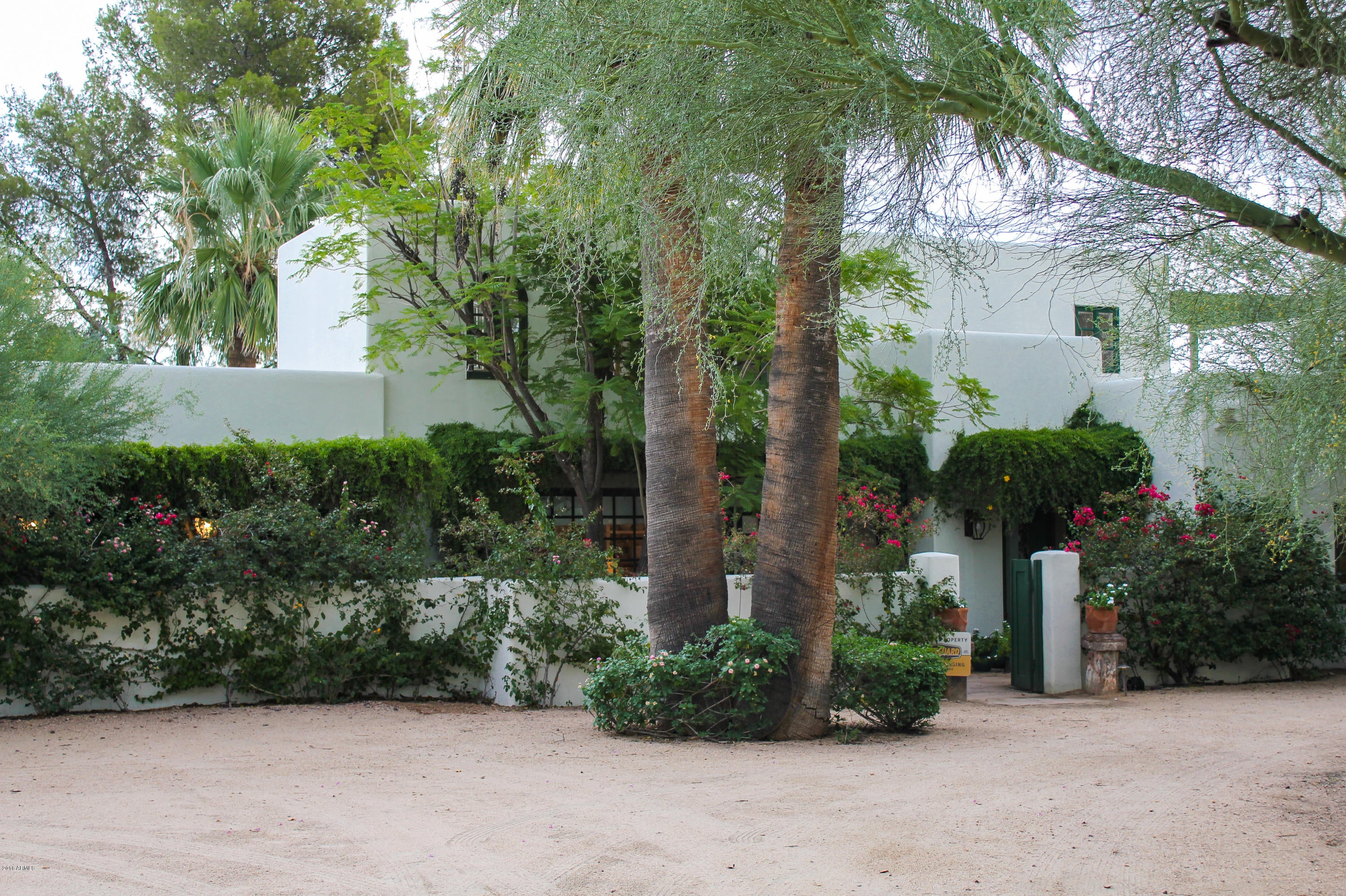 Where ART and SOUL  MEET!
Artist/designer's own home...Come see this Italian ''Flower Cottage'' and roam this Paradise Valley acre with unobstructed views of Camelback Mountain. 2,743 Square Feet of hand crafted soft sculptured plaster walls, three bedrooms and two baths (master and other bedroom en suite downstairs with a unique studio/office space. Tongue and groove ceilings throughout...flagstone floors with light dancing through the hand made windows and French doors! Front and back covered patios spectacular entertaining/meeting space overlooking grassy area with mature landscaping and pool.  Located in the ''sweet spot ''of Paradise Valley.  This one redefines charm, warmth, and graciousness.  A peaceful place to live, think, and emanate out from!