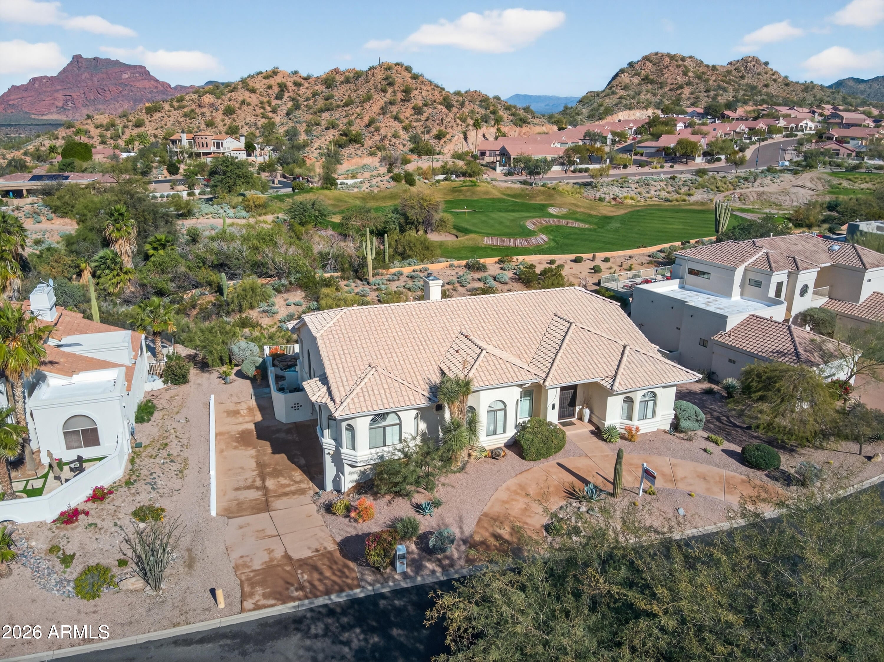 Discover luxury living on the Red Mountain Golf Course. This rare basement home, just 5 miles from the Salt River, offers breathtaking mountain and sunset views on a sprawling half-acre lot.

The main level features a remodeled chef's kitchen with high-end finishes, formal dining, and a wet bar. The lower level is a perfect multigenerational suite, complete with its own kitchenette and separate laundry hookups on both floors.

Outside, enjoy the ultimate Arizona lifestyle with a sparkling pool, spa, and expansive yard with room to grow. From the picture-window breakfast nook to the unforgettable desert vistas, this home is a desert masterpiece.

Highlight: $5,000 lender incentive available for qualified buyers. Experience this exceptional estate today!