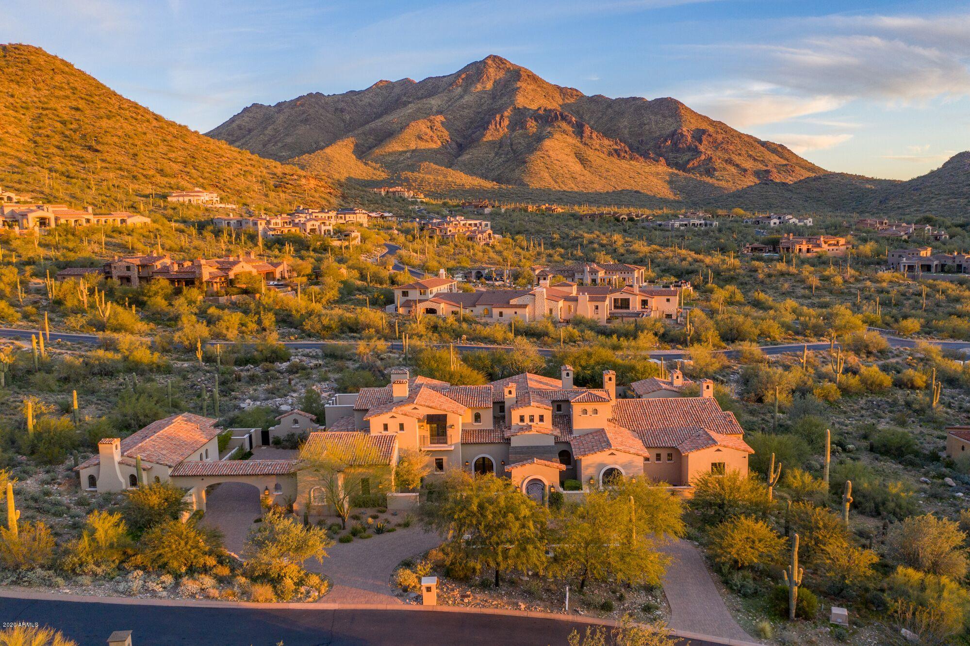 Welcome to one of the few transitional homes available in Silverleaf's Upper Canyon. This prestigious estate is ideal for family living and entertaining. Built high into the McDowell Mountains, this legacy home sits on 2+acres encompassing beautiful mountain views from all angles. Enjoy the outdoors on the expansive lawn, dinner on the covered patios, morning tea from the viewing deck, or fun with family from the resort style pool + ramada. Host your friends for a comfortable stay in the guest house. The quality of this quintessential is unparalleled.  Designed and built for fun! No detail was spared and nothing overlooked in creating this lifestyle home. Located just minutes from Scottsdale Airpark and steps from world renowned shopping, dining, and entertainment. SEE MOTION VIDEO... Home features:
* Whole house is on Control 4
* Double dishwashers
* Miele espresso machine
* Bar w/ double refrigerators and ice maker
* "De Chateaux" fused white oak flooring
* 4 laundry locations: main laundry, guest house, upper floor, master bedroom
* Custom closets throughout
* 7 fireplaces
* All bedrooms en-suite
* Den for kids
* Media room with top of the line equipment and seating for 15
* Central vac
* Water softener system
* Outdoor BBQ area
* Ramada with guest bath
* Room for an elevator