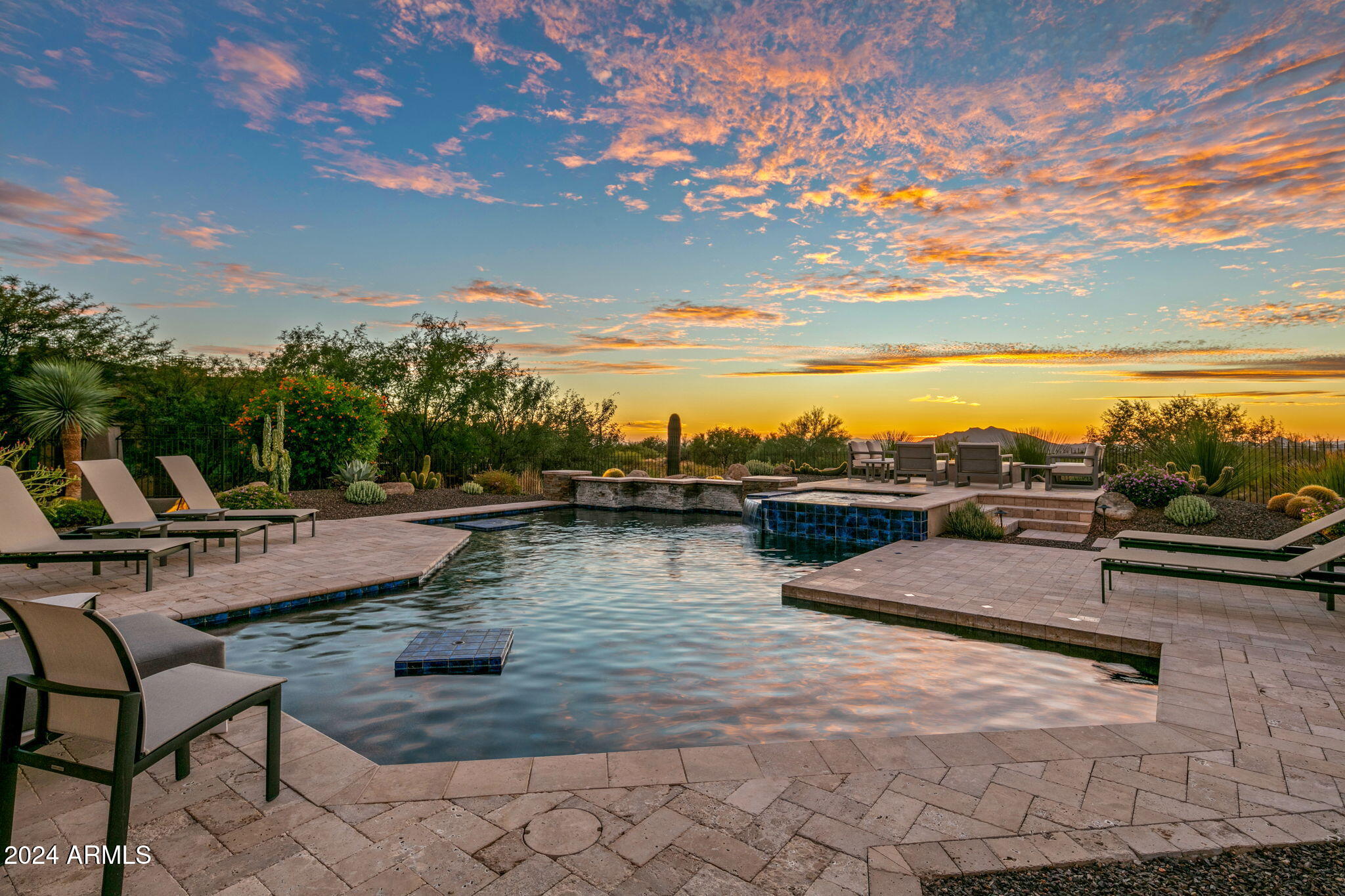 FULL GOLF MEMBERSHIP AVAILABLE PER CLUB BYLAWS! This Southwest Custom Contemporary home has style and design features that are unique and desirable. The moment you step into the home your gaze is drawn across the living rom and pool area to the fairway and distant mountains. A very livable floor plan with a split master and a full guest casita. The auto court leads to a 4 car garage with enough space to include your golf cart and plenty of storage. Tour this amazing home and you'll see the quality of construction and style. The home is fully furnished and ready to move right in.