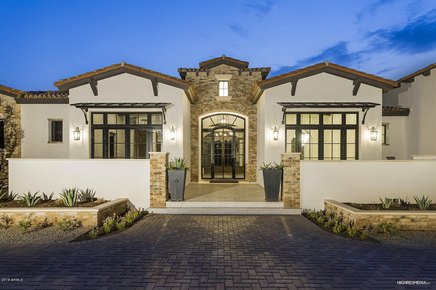 Huge Price Reduction! Just completed on the very popular Casa Blanca Drive, a walled in and gated estate home featuring the finest finishes and details to be seen, a 804 bottle steel/glass wine room, reclaimed brick accents complete the exterior and ramada, swim up bar features a covered ramada and a dream pool truly one of a kind, no expenses spared on landscaping the grounds with date palms throughout and lots of vegitation, limestone pavers in backyard/courtyard, very private and entertainers dream home, wood floors throughout, back yard captures Camelback/Praying Monk views, every room has its own unique finishes, Guest house has a full kitchen with family room and captures views of the backyard/pool, you'll truly love the curb appeal and showing experience of this estate home!