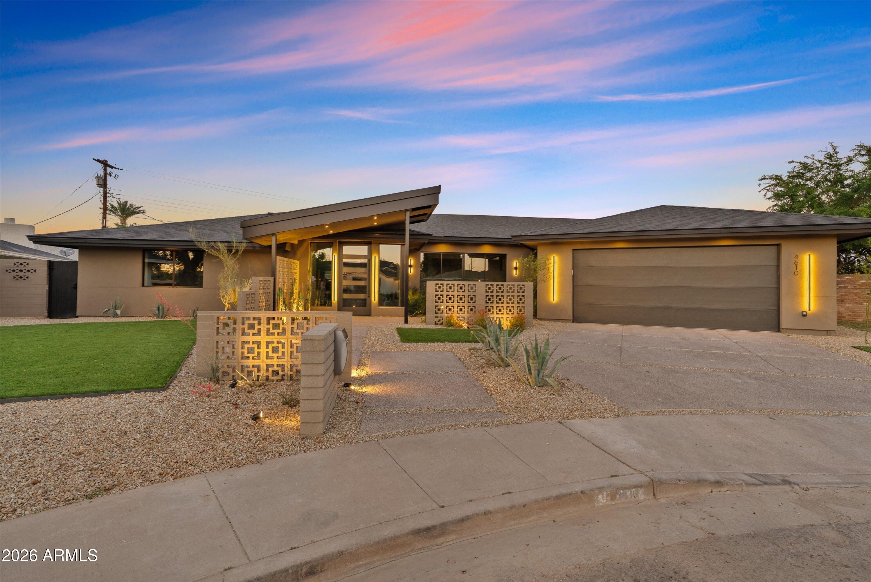 An exceptional opportunity in the coveted Arcadia Osborn neighborhood, this architecturally significant residence was fully remodeled and expanded by award-winning architect James Kottke. Positioned on a quiet cul-de-sac on a large oversized lot, the home captures stunning Camelback Mountain views and delivers refined, design-forward living at the highest level. A striking ''Palm Springs'' breeze block entry opens to a private front courtyard, setting the tone for the sophisticated architectural details throughout. Inside, a seamless open-concept layout showcases expansive living spaces, clean modern lines, and walls of glass that flood the home with natural light while framing iconic mountain views. The chef's kitchen is both statement-making and highly functional, featuring Monogram appliances, a 48-inch gas range, double dishwashers, wine refrigeration, a dramatic waterfall island, custom cabinetry, and a fully equipped butler's pantry, thoughtfully designed for effortless entertaining. The primary suite serves as a serene retreat with spa-inspired finishes and curated design details, while five additional bedrooms offer generous space for guests, office, or fitness. The resort-style backyard is designed for elevated Arizona living, complete with a sparkling pool, covered entertaining areas, and expansive grounds, all set against the dramatic backdrop of Camelback Mountain. An oversized 3-car garage provides ample room for vehicles, toys, and additional storage. Moments from Arcadia's premier dining and shopping, this is luxury living in one of Phoenix's most prestigious neighborhoods