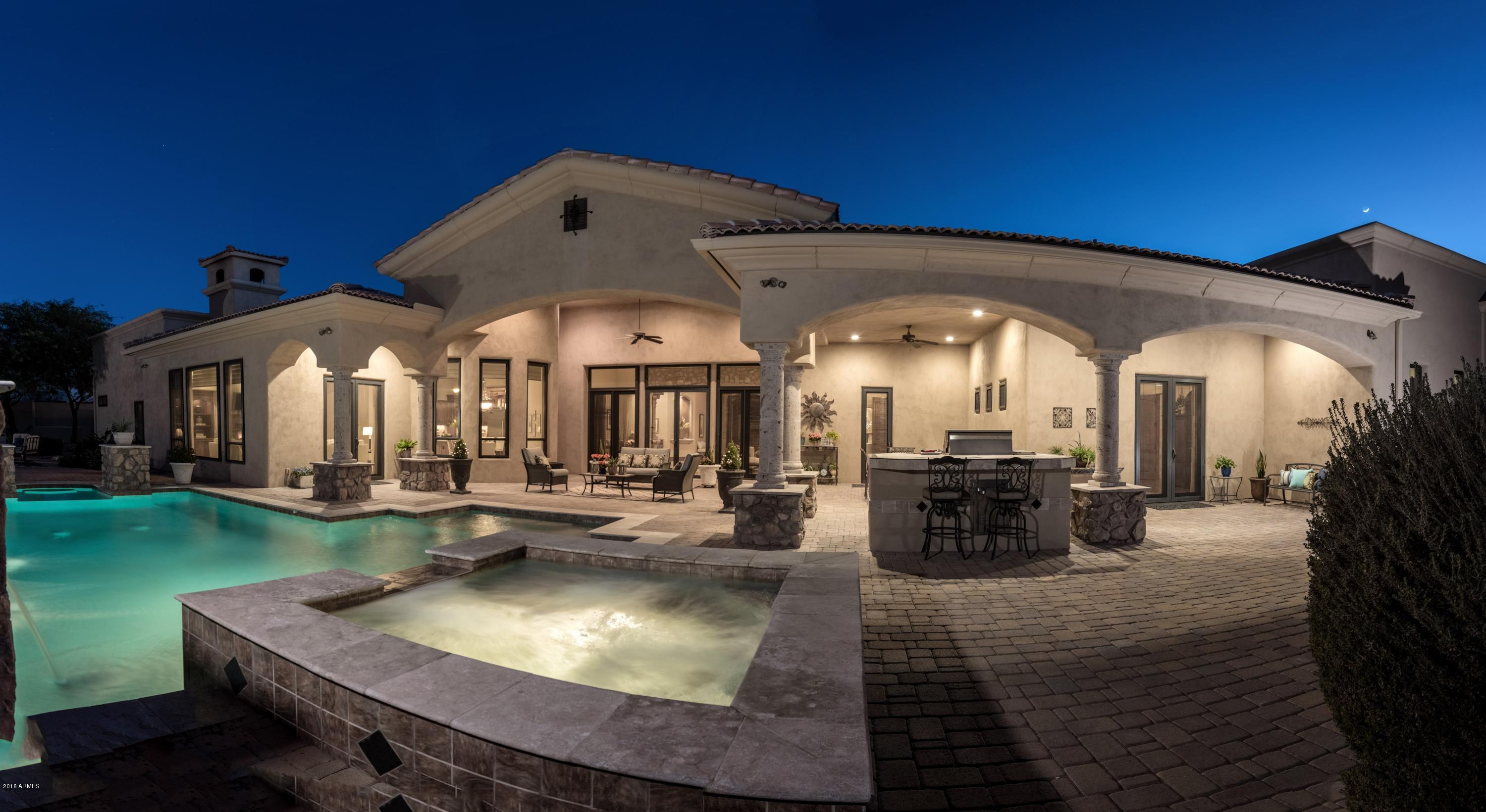 *WANT A HOME OF PERFECTION? THEN THIS CUSTOM 5,534sf, SINGLE LEVEL HOME(no steps)FITS THAT REQUEST!*No custom feature spared!*Perfect floor plan w/travertine & hardwood floors(NO CARPET!)Formal Dining/LR w/gas fireplace opens to the amazing patio/pool beyond!*Gourmet kitchen w/custom alder cabinets,Viking Stainless appls w/gas range,2 dishwashers,ice maker,beverage center,warming drawer & breath taking ceilings!*Massive butlers pantry & Wine Cellar*Kitchen open to cozy Family Room w/cantera fireplace/built-in cabinets*Large laundry w/stainless washer/dryer that conveys!* Office/bedroom w/closet*Hall powder/pool bath opens to back yard patio*Massive Game Room/Theater/or multi purpose room has beverage refrigerator & bar area*Gorgeous Master Suite w/hardwood floors, exits to roof deck/patios Luxurious walk-in shower in Turret of home has natural window lighting!*Jetted Tub and his/her sinks encompass this elegant bath!*Custom wood closets w/custom built in cabinets and shelving!*Second bedroom has ensuite bath w/another turret shower!*Bedrooms 3&4 have own sink and combined shower area*Custom boxed ceilings, art niches, 8in high base boards, breathtaking vaulted & coffered ceiling w/wood beams, etc. make this a must-see home. A Generac gas backup power generator, security door & window screens, outdoor landscape sprinkler system, monitored security and in-home fire sprinklers make this a wonderful no worry primary or second home. Sparkling heated salt water pool/spa, water feature, built-in barbecue, Massive 1,200 s.f. covered patio, pit and open space, ideal for family/pets/entertaining*4 car garage with built-in storage and NEW epoxy flooring.... Located on quiet cul-de-sac with roof-top views of mtns and city lights, courtyard and privacy fence complete this fabulous home*This home is NOT TO BE MISSED!*