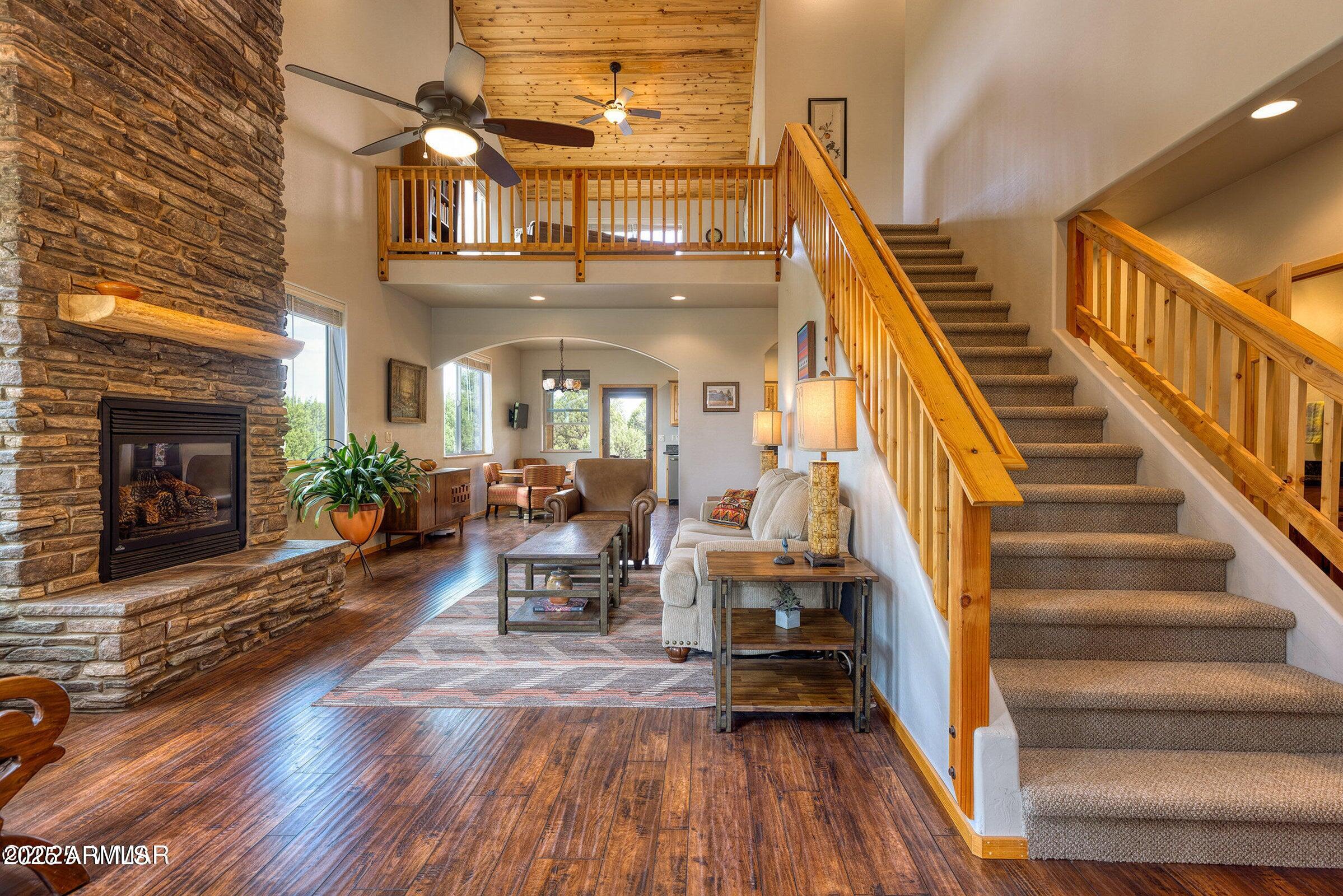 Ready to embrace small-town mountain living? This is the one. Located in the highly sought-after Show Low Bluff community, this beautifully appointed 3-bedroom, 2.5-bath home blends comfort, charm, and scenic surroundings. Step inside to soaring ceilings accented with warm tongue-and-groove detail and a striking stone gas fireplace--creating an inviting space perfect for cozy evenings. The spacious kitchen features a large island with gas cooktop, ideal for gathering and entertaining while staying at the center of it all. The main-level primary suite offers convenience and privacy, with direct access to an expansive Arizona room lined with oversized windows that flood the space with natural light. Ready to embrace small-town mountain living? This is the one. Located in the highly sought-after Show Low Bluff community, this beautifully appointed 3-bedroom, 2.5-bath home blends comfort, charm, and scenic surroundings. Step inside to soaring ceilings accented with warm tongue-and-groove detail and a striking stone gas fireplace--creating an inviting space perfect for cozy evenings. The spacious kitchen features a large island with gas cooktop, ideal for gathering and entertaining while staying at the center of it all. The main-level primary suite offers convenience and privacy, with direct access to an expansive Arizona room lined with oversized windows that flood the space with natural light. Upstairs, you'll find two generously sized bedrooms plus a versatile loft, perfect f

relaxing or taking in the sweeping northern and western views. Enjoy stunning Arizona sunsets right from your own home, along with frequent visits from local wildlife, including deer and elk.

Experience the beauty, tranquility, and lifestyle that make mountain living so special--don't miss this opportunity to call it home.

Exterior of home is scheduled to be painted in mid-June, the same color and scheme. Adding peace of mind and cost savings for you!
