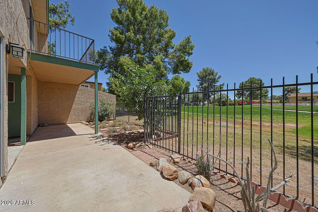 Rare private golf course lot!  This 2 BR, 2 BA corner unit townhome offers peaceful views of Hole 7 of the Bellair Golf Course - a unique setting that few units in the community can match.  Kitchen with stainless steel appliances, pantry, and breakfast bar, along with great table space.  Second level features two bedrooms with WIC.  Primary BR with sliding door to deck with views of the golf course.  Both bathrooms have been beautifully updated.  Ceiling fans in all rooms.  Laundry room off patio, washer and dryer are included.  Newer hot water heater.  Unit comes with one assigned covered parking spot.  There is plenty of guest parking close to unit.   Bellair amenities include pool, parks, pickleball courts, basketball courts, and public golf course.