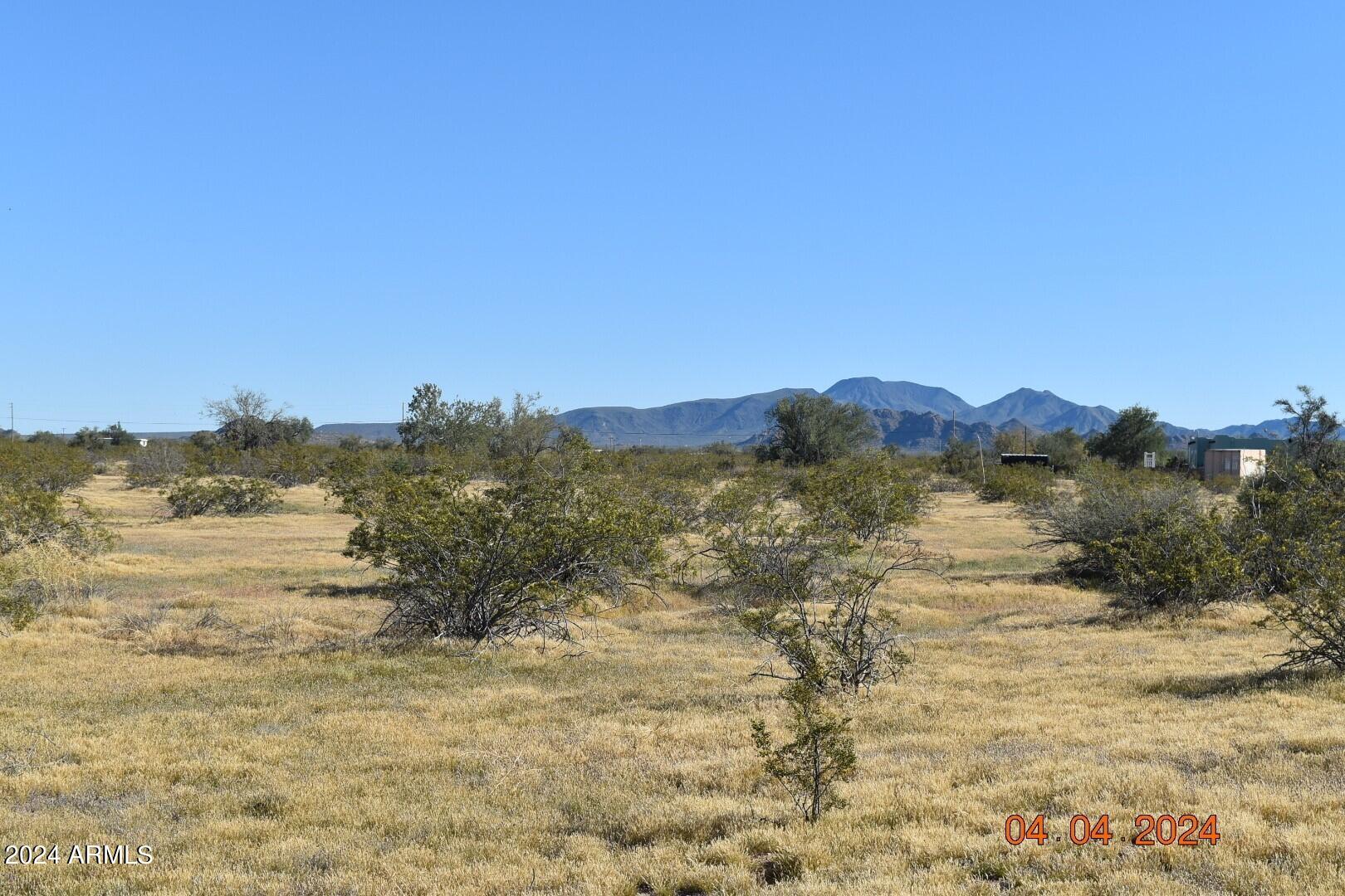 Look at this excellent lot in Maricopa just off the Warren Road Corridor!  Flat, easy to use, with a good dirt road and easy access back to pavement.  Views are nice as well, and you will not be disappointed in the area.  This is excellent value for a 1.25 Acre lot in Maricopa.  Look what has happened to Wittmann, Surprise, Buckeye, Tonopah. You can't touch a lot like this for anywhere near this price.  These prices are not going to last at this level for long, and you will be wishing you had gotten more than one.  This is a charming area, and it is a future hotspot for good Arizona living.   
 *Seller financing is possible, with a strong down payment!  Seller has more lots adjacent to west if you need more space!