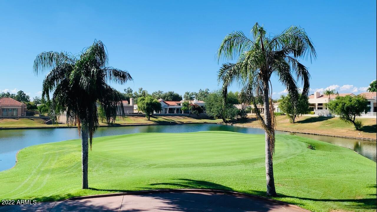 Beautifully remodeled soft contemporary home in guard gated Scottsdale Country Club, located on the best lot overlooking the 4th pin of the Starfire Golf Course, lake and McDowell Mountains. This home was taken down to the studs and concrete slab and redesigned to provide a more modern and open concept, taking full advantage of the golf course and lake views. High-end finishes include French oak porcelain wide-plank flooring, Modern Flames linear fireplace framed by white matte oversized porcelain tiles, white shaker cabinetry, custom designed range hood, Calacatta quartz countertops with waterfall island and backsplash, modern pendant lighting, under cabinet lighting recessed can lighting and new stainless appliance package with gas range and waterfall bar with beverage fridge.. The brand new luxurious master bedroom suite provides a spa-like feel with a double vanity, freestanding tub, frameless glass shower enclosure, premium faucets and fixtures, as well as a large walk-in custom closet and French doors that lead out to your private heated spa and pool. The very functional and well laid out floor plan is complete with an additional secondary bedroom suite with private en-suite bathroom as well as two additional bedrooms, a full bathroom plus a powder room. The backyard offers a sparkling pool, spa, BBQ, adobe style fireplace and a covered patio to take full advantage of Arizona's desirable indoor-outdoor lifestyle. Within walking distance to the community pool/spa/tennis courts and Starfire Golf Course Clubhouse and Grille. Close to Kierland, Scottsdale Quarter, shopping, dining, resorts, golf courses & all Scottsdale has to offer.