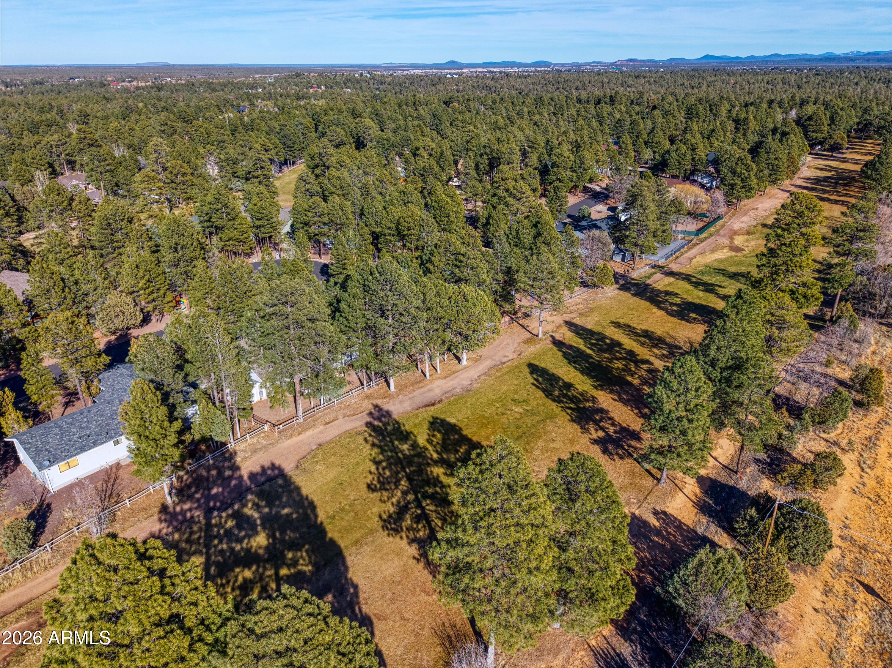Beautiful low-maintenance home located on the 17th fairway of Bison Golf Club in the heart of Show Low. Nestled among tall pines with serene golf course views, this 3-bedroom, 2-bath home offers the perfect mountain retreat for year-round living or a seasonal escape.

The desirable split floor plan provides privacy for the spacious primary suite, while large windows bring in natural light & frame stunning fairway views. The bright kitchen features stainless steel appliances and opens to comfortable living spaces ideal for entertaining.

Recent updates include a brand-new roof, fresh interior paint, new carpet, and updated baseboards--giving the home a clean, move-in-ready feel. The property also offers a long driveway plus a dedicated RV parking pad, a rare find on the golf course. No HOA provides flexibility, making this an excellent opportunity for a full-time residence, vacation home, or short-term rental/Airbnb investment. Conveniently located near Hwy 260, Torreon Golf Club, shopping, dining, and outdoor recreation, this home blends peaceful golf course living with easy access to everything Show Low has to offer.