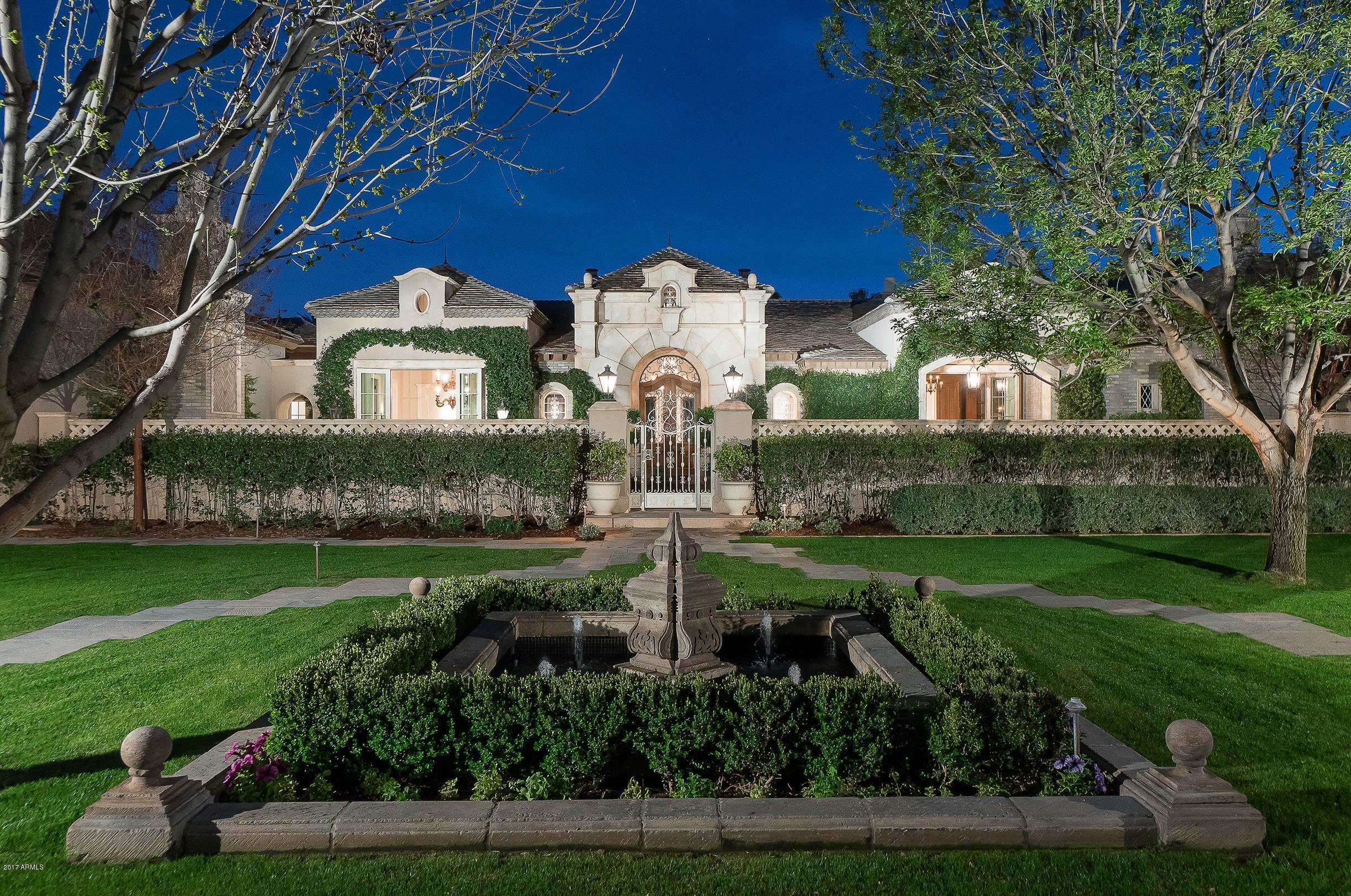 THE TIME IS NOW! | CASUAL FRENCH EXCELLENCE | MRA Custom Homes presents: This breathtaking European-esque timeless masterpiece was built to last a lifetime with solid masonry construction coupled with only the finest and most exquisite finishes. Unobstructed Mummy Mountain Views from the backyard from nearly every South facing window and door. Lower operating costs thanks to the multi-layered roof system, a 9.2 K.W. solar photo-voltaic system, 2 solar water heaters, and the full use of a PRIVATE WELL for irrigation. Allows for grand entertaining but skillfully designed for year round intimate enjoyment. Never occupied and IMPECCABLY maintained! PRICED FAR BELOW A 2017 APPRAISAL!