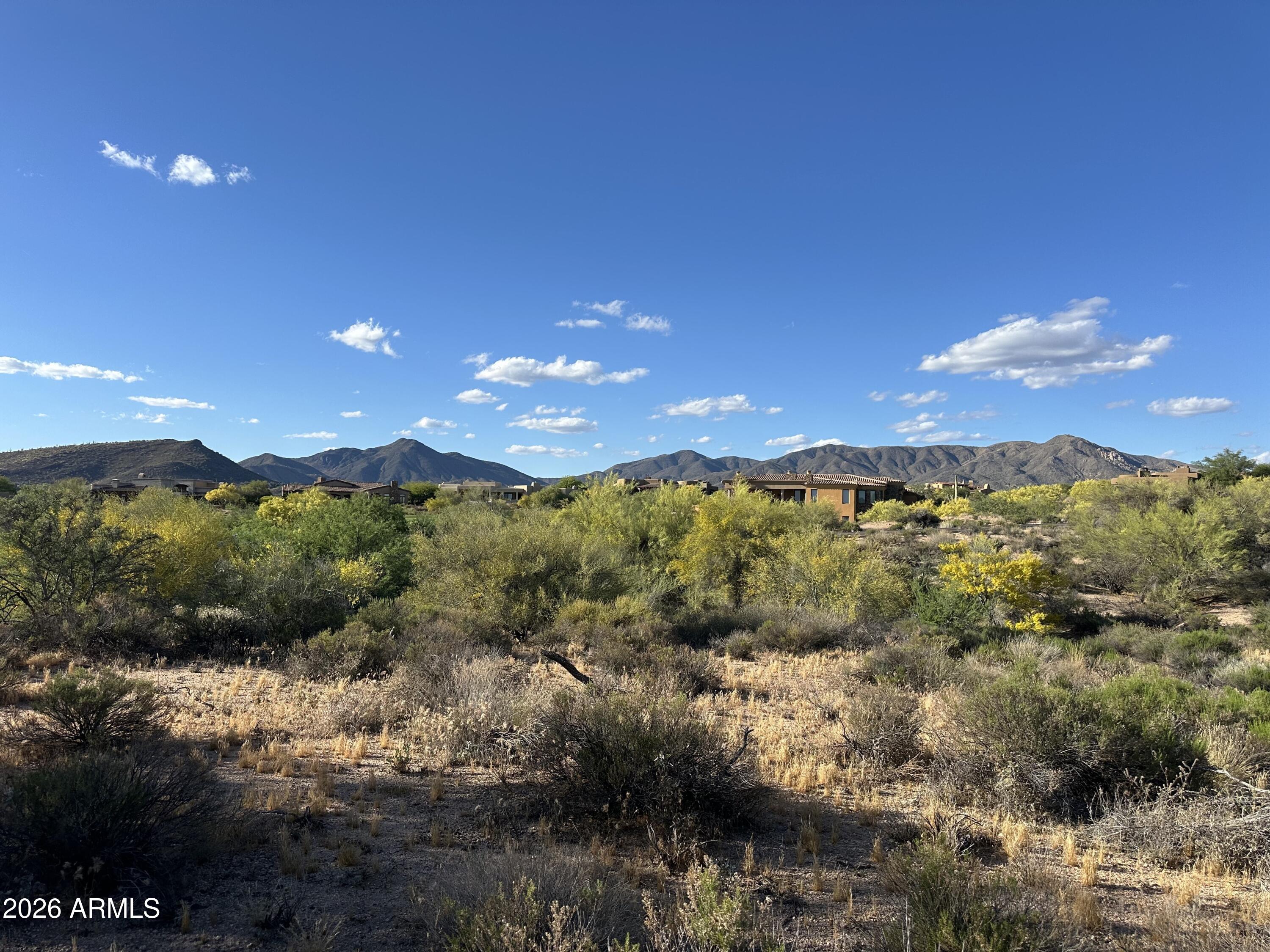 Relatively flat/easy build homesite in Desert Mountain's Village of Eagle Feather. Over an acre with a 23,609 square foot envelope allows for design flexibility. Enjoy sunset and mountain views in one of Scottsdale's premier outdoor lifestyle communities! The location of Eagle Feather is close to the main gate for quick access to shopping and dining. Additional community amenities include golf, biking and hiking trails. The Sonoran Fitness Center (spa, pickle ball, tennis, swimming, fitness facilities and much more) is nearby. No membership included. Please inquire with Club regarding memberships.