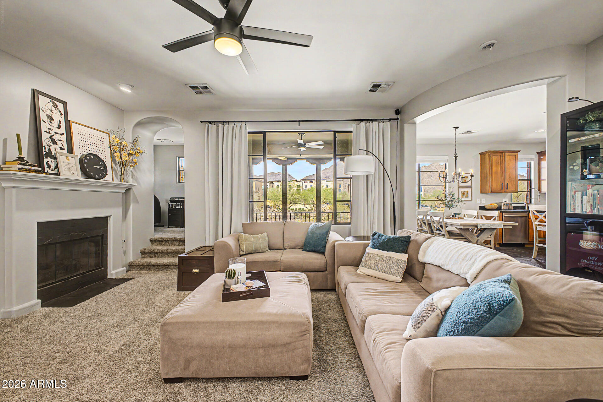 Experience the coveted DC Ranch lifestyle in this gated 2-bedroom, 2-bath home with bonus office space on the second level. Enjoy stunning McDowell Mountain views from your private balcony, along with upgraded, tasteful finishes throughout. The thoughtfully designed kitchen features newer appliances, a gas range, and opens to inviting living spaces highlighted by a cozy gas fireplace. A 2-car garage with direct unit access adds everyday convenience. Residents enjoy an abundance of amenities including a pool and spa, kids' splash pad, multiple community centers, parks, and access to the nearby Village Health Club & Spa. Outdoor enthusiasts will love being close to the popular Gateway Loop Trailhead and endless hiking opportunities.