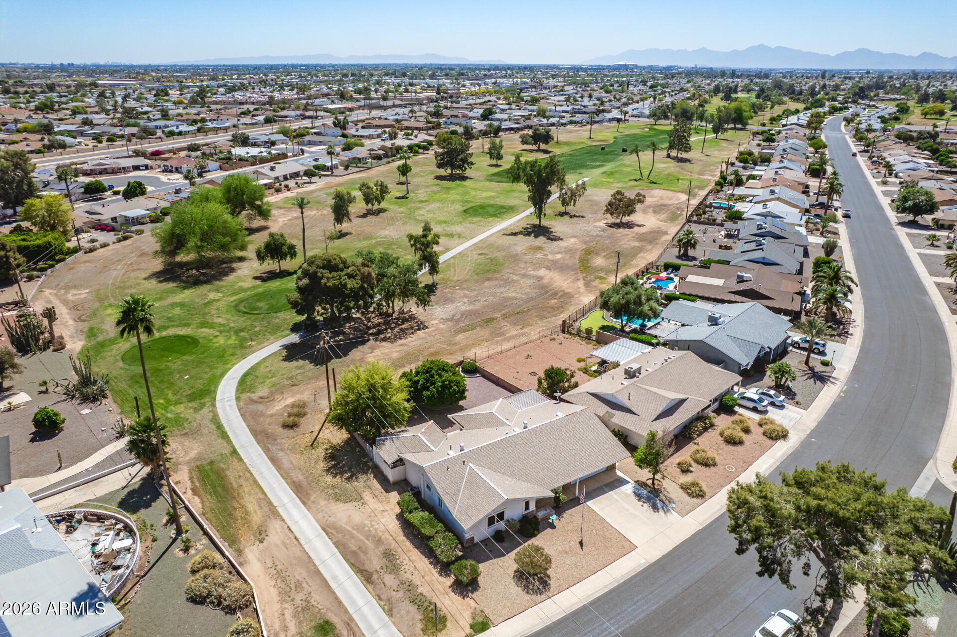 Discover this charming 2-bedroom + den home in the sought-after Sun City with great golf-course views! Explore the inviting living spaces featuring upgraded carpet, tile in all the right places, abundant natural light, and two-tone paint. Whip up your signature dishes in the bright kitchen, displaying detailed cabinets, ample counter space, a breakfast bar, and built-in appliances. The tranquil main retreat promises a good night's sleep and hosts a walk-in closet with mirrored doors, a bathroom with double sinks and a separate shower & tub, and direct outdoor access. Two separate living spaces, indoor laundry, walk-in pantry, plus plenty of storage in the garage. Out back, you can enjoy the views of the golf course from the covered patio or the courtyard. New sewer in 2022! A/C unit with programmable thermostat is 5 years old and blows cold! This home has it all! Be surrounded by the South Golf Course - a golfer's delight! So close to the Fairway Center, and down the road from the Bell Center! So many activities for your Active Adult Lifestyle. Put this one your list to see today!