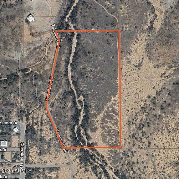Large parcel right off I-10 with homes to the west and views to the east.  Wide open space just outside of town.  Experience your own part of Arizona or develop for profit.  Motivated seller.  Financing is available.