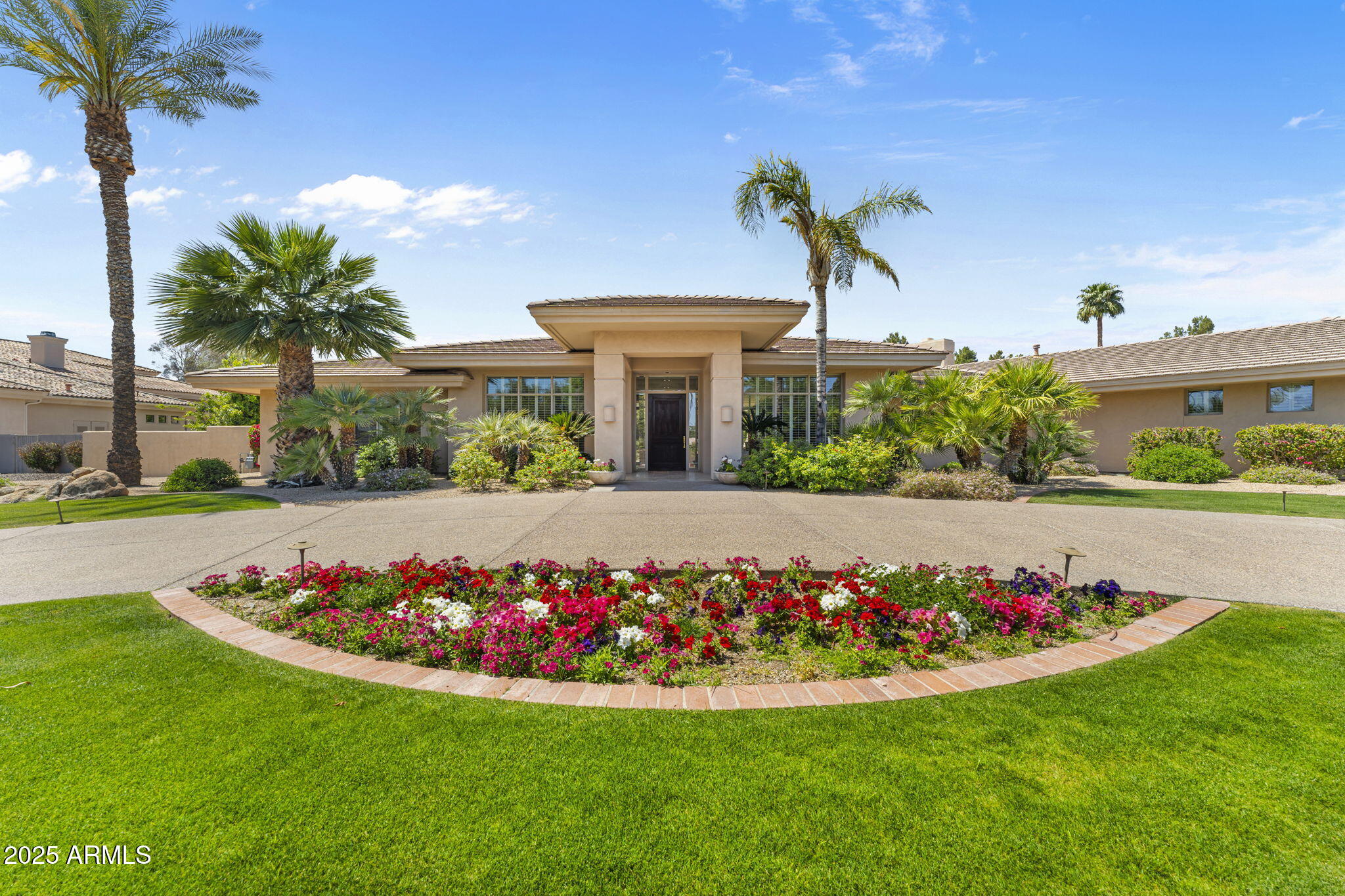 Welcome to Cheney Place, an exclusive gated sanctuary in the heart of Paradise Valley, AZ. This luxurious 6-bedroom, 5.5-bath estate with a 4-car garage offers the perfect blend of sophistication, comfort, and resort-style living. Designed with a seamless open floor plan, the home features expansive living spaces that flow effortlessly from indoors to out. The stunning primary suite is a private retreat, complete with dual oversized closets, separate water closets, a spa-inspired bath area, and an impressive walk-in shower.

Entertaining is a dream with a custom bar that opens to a spacious outdoor patio—ideal for unforgettable gatherings. The home also boasts a large laundry room, a dedicated wine room, and elegant designer touches throughout. Step outside into a true backyard paradise with Camelback views featuring a shimmering diving pool, relaxing hot tub, sport court perfect for pickle ball or basketball, and a lush green lawn for endless fun and relaxation.

As a bonus, a full guest casita offers ultimate privacy for visitors or extended family. Located just minutes from top-tier restaurants, upscale shopping, and world-class golf, this home provides the best of Paradise Valley living. Don't miss this rare opportunity to own a slice of luxury in one of Arizona's most desirable private communities.