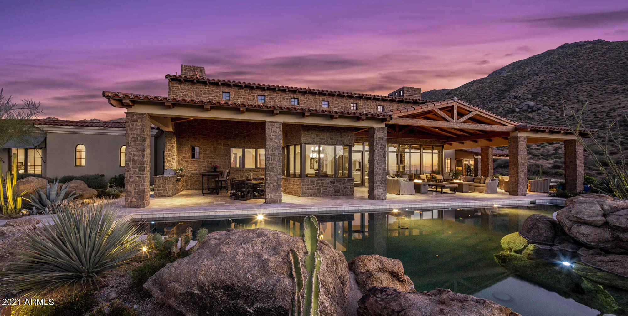 Picturesque 360 degree views surround this transitional masterpiece. Award-winning PHX Architecture's Erik Peterson perfectly positioned the home to maximize its premium lot with Protected Views and elevation at 3,200 ft. to capture miles of close and distant mountain views. Completed in 2015 by Schultz Development Custom Homes with the highest quality construction and luxurious finishes throughout. An impressive team of interior designers and landscape/pool architects partnered to highlight and blend the home's features with the natural desert scenery. Grand living spaces, chef's kitchen with two islands, 5 car garage, EV Tesla charge station, expansive covered patio with negative edge pool, new iron gates installed on east side of home, home theater, home office, Savant Pro smart home automation with 2 new WiFi expanders added, new color LED lights in pool, automatic shades/sunblocking shades added in master bath, and more. Meticulously maintained! Furnishings (all available via separate bill of sale) make this a unique opportunity to purchase a turn-key home, move-in ready for the upcoming peak season. The Estates at Miramonte, a gated enclave tucked away in the N. Scottsdale Troon area, is ideal for those seeking privacy, tranquility, and the acreage to feel secluded, while in living in close proximity to the hiking/biking trails of the McDowell Sonoran Preserve, world-class private and public golf clubs, and a variety of fine dining, arts and recreation for a truly active lifestyle. Property features in documents tab.