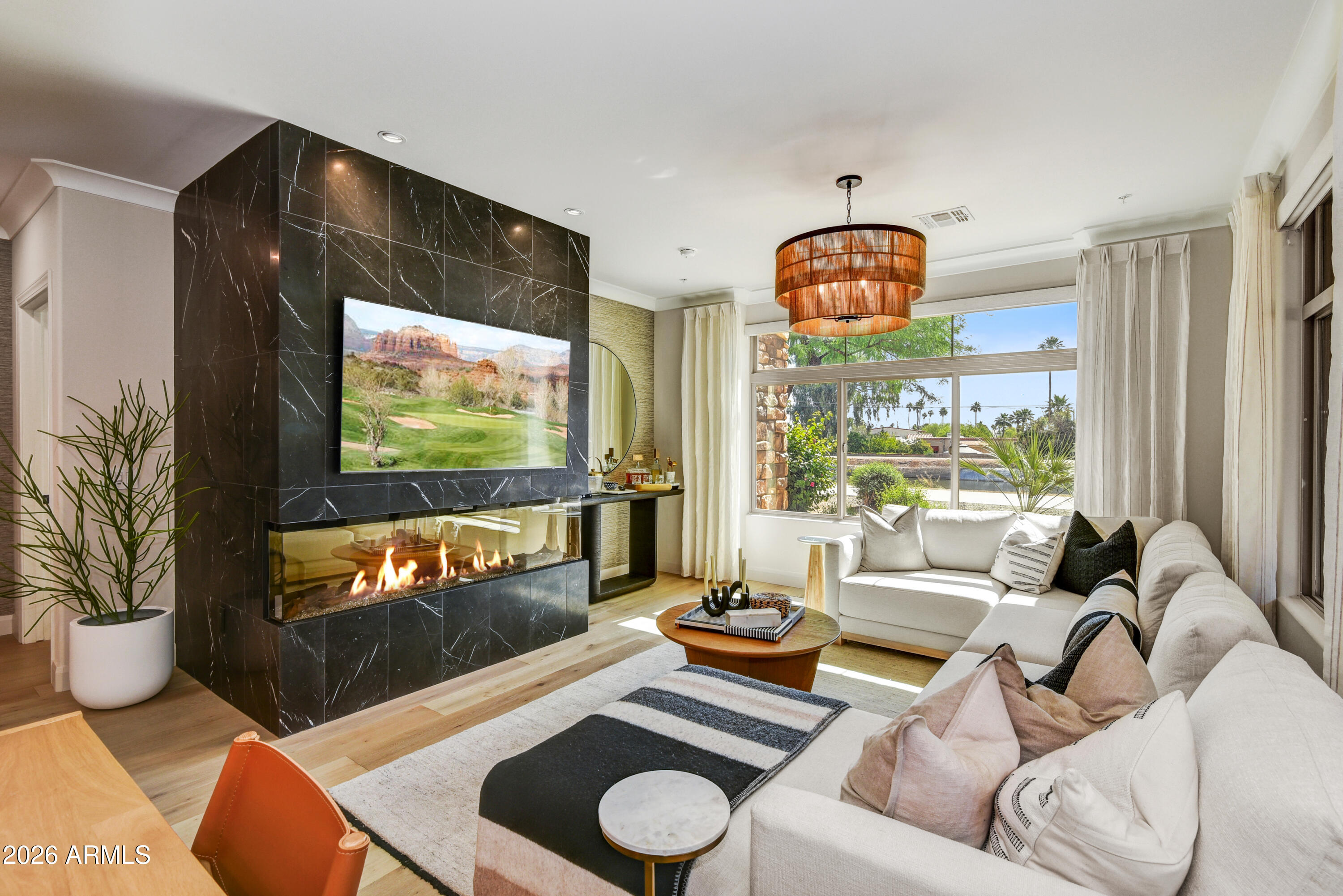 Experience resort style living all within walking distance to Old Town Scottsdale. This ground level, single story corner unit features premier luxury finishes throughout and was spared no expense during renovation with total costs exceeding $100,000.  2 designated garage spaces, direct access to Scottsdale waterfront, and luxury community amenities such as a state of the art club house, fitness center, community pool, spa, common spaces and patio areas.