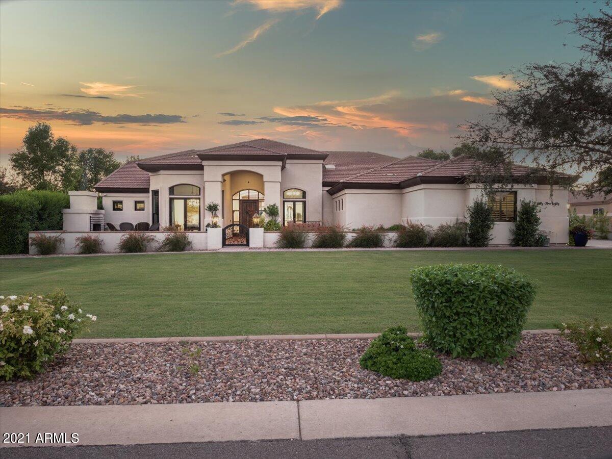 ~2021 DREAM HOME LIST~SMART, ENERGY EFFICIENT New Build~Complete Front & Back Landscaping, EVERY UPGRADE, POOL, SPA, BIG LOT & PREMIUM LUXURY South Chandler neighborhood~TODAY THIS COULD BE YOUR REALITY~2018 REBUILD 
Curb appeal begins with impeccably kept grass & flowery walk to private gated courtyard, paver lined, fireplace for gathering, shared with grand entrance and flanked by French doors of dining room and den entrances~Once in the foyer, your eyes are drawn to so much to discover, yet it is impossible to not gaze straight out the Great Room's Sliding Wall of Glass inviting the Kitchen/Dining/Family spaces onto the covered Patios/Pools/Spas/Gardens in your Huge  Backyard~Over 0.8 acres could be all yours~Dining, Playing, Lounging, Soaking & Swimming~ Extra Lg rectangular pool.... & hot tub perfectly and symmetrically placed in to center of grassy fields for running and playing, several pavered patios, mature shade trees and raised beds for gardening. The interior is comfortably redesigned for the most convenience and comfort combined with maximun space for entertaining and loving life from the extensive patios to the chef's kitchen design which invites more than just family to belly on up to the bar in the kitchen and share time cooking at the 48" Wolf dual fuel range, that also has griddle, accompanied with Wolf hood, micro, Asko dishwasher, paneled Subzero Fridge/Freezer and separate ice maker~The butler's pantry, in addition to drawers and numberous functioning cabinets under the island yield loads of storage and surface area for parties and party planners~Great room has great entertaining with large wall mounted TV all controlled by the top of the line AV components and Smart Function on location or remotely~Formal Den space could surely be used as an office with separate entrance and Formal dining is currently more for fun, but the double chandelier illumination sets the stage for a formal space to seat at least 8 comfortably~The master suite is beautifully and naturally lit with loads of windows, large and welcoming, with space for all and private access to your amazing yard, Master bath has 3 vanities~2 of the secondary bedrooms share a Jack and Jill bath and Bedroom 4 is en suite, also with own private entrace to the yard and pool~The oversized laundry room has built in lockers, 4 clothes hampers, and audio visual entertainment while in this beautiful space as well. 
Simply and tastefully stated, this Spanish influenced Mediterranean Custom Home presents comfort, luxury, and mostly pride of ownership. Security, Smart and Energy Efficiency is represented so well and makes this home simply uncomparable to the rest. Please hurry to visit. She is dressed to impress.