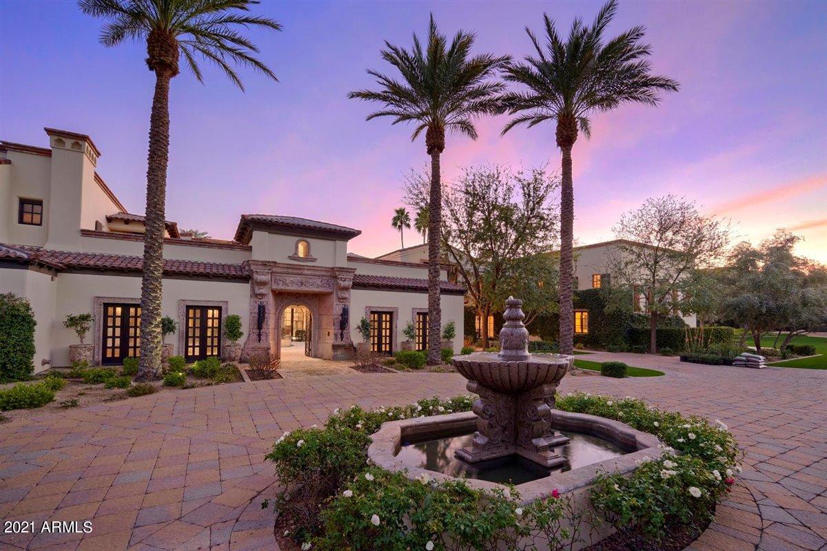 Welcome to ''The Villa''; a 3 acre Paradise, here in Paradise Valley; surrounded by lush mature landscaping for a discriminating buyer who values Privacy at the top of their search. Upon your arrival, you'll be welcomed to a circular drive centered by a water fountain, then splits into two separate tropical style motor courts, leading to garage parking on both sides of this estate. You then may access the home by going through one of its private courtyards built by reclaimed Chicago stamped bricks. The Main Courtyard welcomes guests to a second centered water fountain, overlooked by Romeo and Juliet style balconies, allowing for a second lair of privacy before entering the main residence. The guest house courtyard entrance welcomes guests through its original Mexican mesquite See MORE. Mexican mesquite doors from the 1800's. The owner's retreat courtyard is privately accessed through the master bedroom and boasts a dedicated OVERSIZED spa and fireplace.
No expense was spared when constructing this impeccable 22,000 plus square foot classic & timeless retreat. 3 Kitchens, 11 Bedrooms, 12.5 Baths, artistic accents throughout, Billiards Room with built in wet bar, teared Theater, indoor basketball court. You'll notice imported stone and tile throughout the entire property, as well as custom stone fireplaces, grand iron doors and exquisite wood beam ceilings, just to name some of the lavish furnishings and amenities. 
You'll sense standing in a World-class resort, guests can help gain their own dedicated access points for better efficiency. The estate offers multiple entertaining areas, viewing the property's vistas and surrounding Mountains. Its resort style pool is stunning, featuring a lazy river, ideal for soaking in the beautiful Arizona sun. 
Centrally located in Paradise Valley, this estate is just steps from the new Ritz Carlton resort, close to high end shops and restaurants. Opportunities to acquire an estate of this magnitude and beauty are rarely made available. SEE MOTION VIDEO