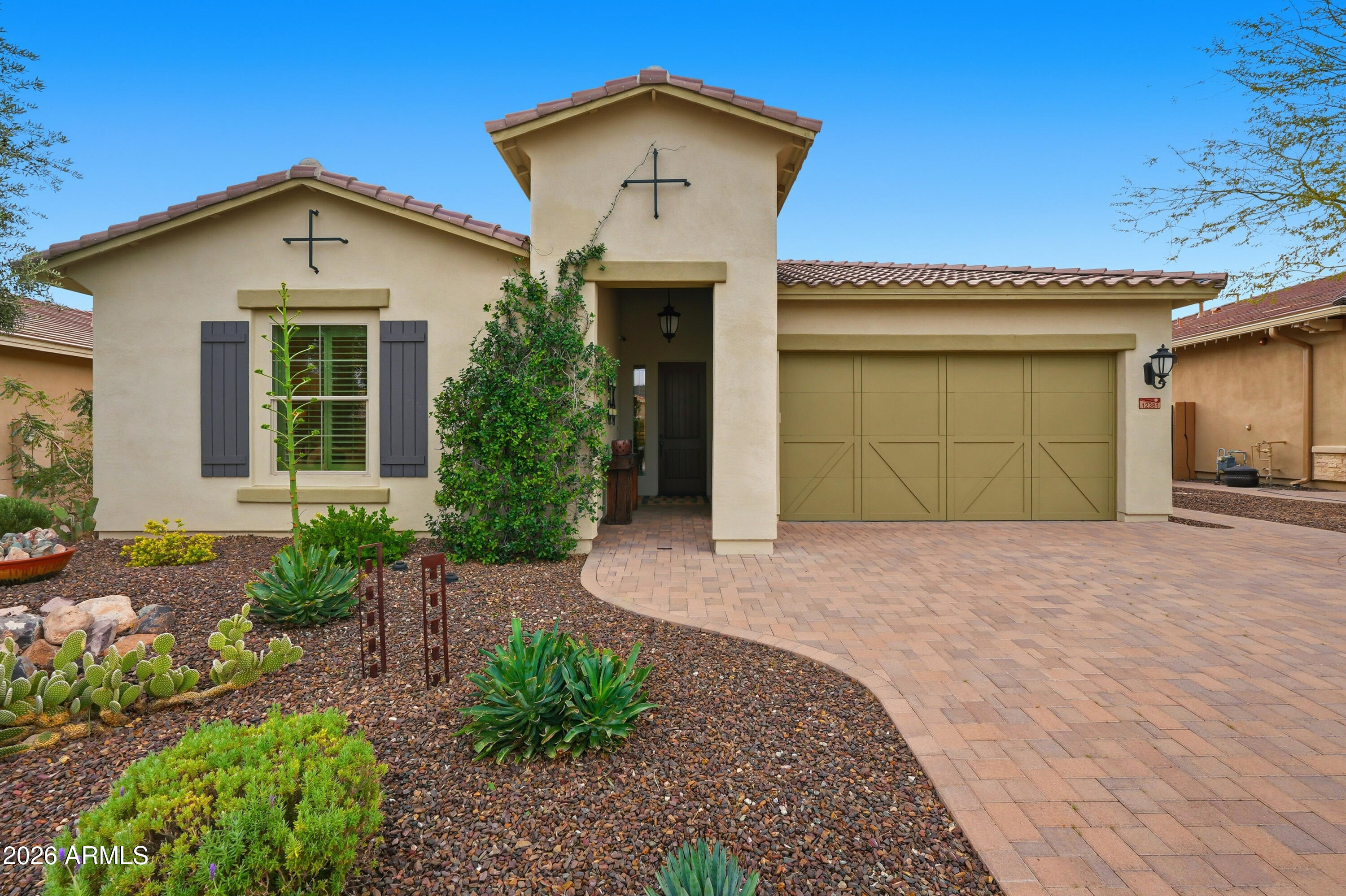 Welcome to Desert Living at Its Finest. Perched on an elevated golf course lot within the prestigious guard-gated community of Blackstone at Vistancia, this stunning 4-bedroom, 3.5-bath residence offers the ultimate Arizona lifestyle with breathtaking golf course and mountain views. Designed for both relaxation and entertainment, this home seamlessly blends indoor comfort with outdoor luxury.

The heart of this home features an open-concept living area flooded with natural light, creating an inviting space for everyday living and entertaining. A dedicated office provides the perfect work-from-home sanctuary, while multiple living spaces throughout ensure comfort for family and guests alike. The thoughtful floor plan includes a fully en-suite guest bedroom, ideal for extended family or visitors seeking privacy and comfort. All other guest rooms have designated bathrooms for added comfort and practicality, ensuring everyone enjoys their own space.

The generously sized primary suite serves as a private oasis, purposefully separated from the other living areas to ensure maximum tranquility. The spa-inspired primary bathroom is designed for total relaxation, featuring a spacious walk-in shower, large soaking tub, and an expansive walk-in closet with abundant storage.

Step outside to discover your own private resort. Expansive sliding doors create a seamless indoor-outdoor flow, opening to a covered entertaining area perfect for Arizona's year-round enjoyment. The backyard showcases a sparkling pool, rejuvenating spa, built-in BBQ area, and generous space for outdoor seating and lounging. Beautifully landscaped with mature lavender and other low-maintenance plants, the outdoor space delivers resort-style living with ease. Whether hosting gatherings or enjoying quiet evenings, this is Arizona living at its best.

Additional highlights include a three-car garage with ample storage throughout, a raised lot position that provides enhanced golf course views and privacy, and a quiet, private setting within the guard-gated, award-winning Blackstone community. With the championship Jim Engh-designed golf course at your doorstep and proximity to the world-class Blackstone Country Club, this is more than a home--it's a lifestyle. Experience the perfect combination of luxury, location, and leisure at 12381 Gilia.