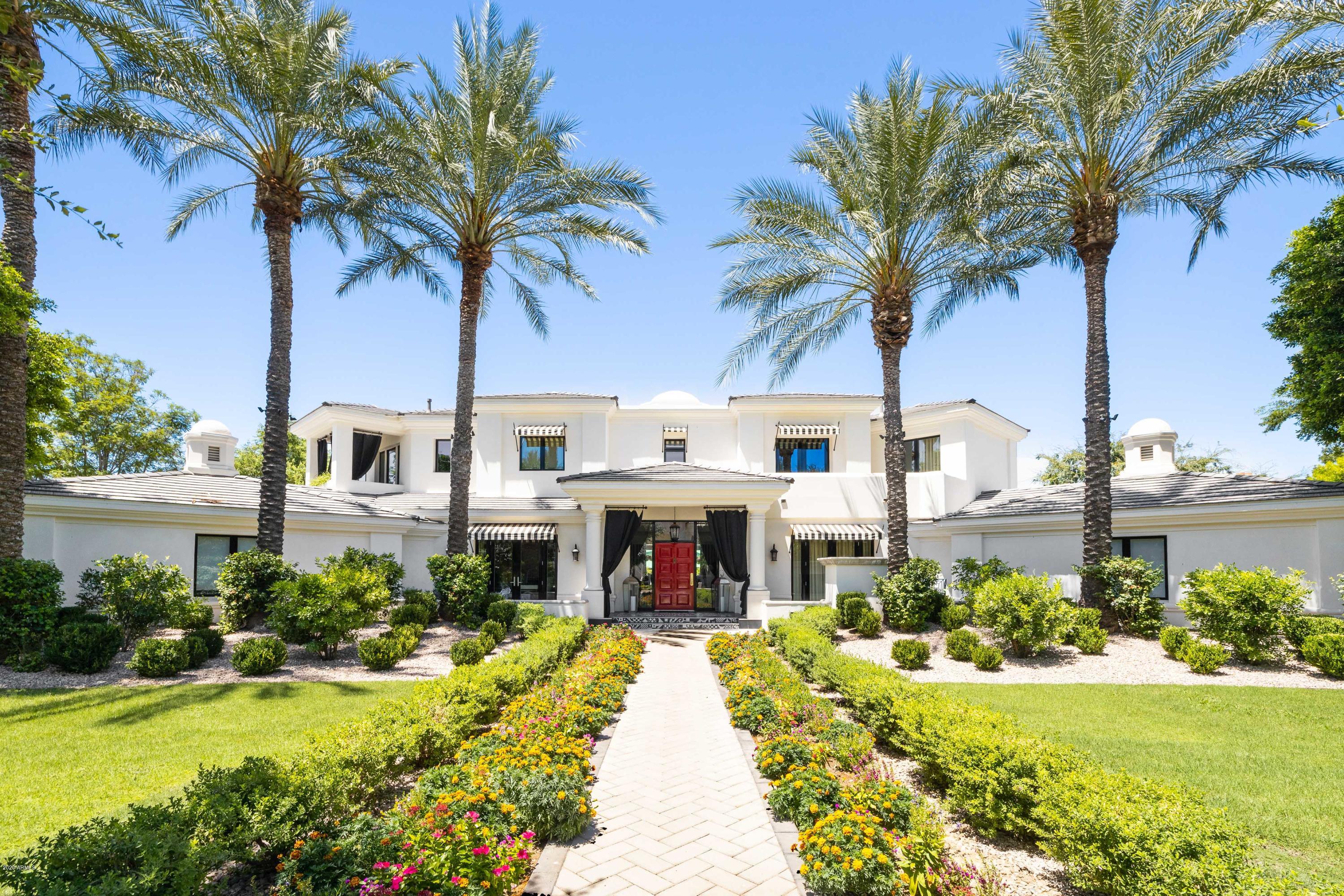 Total SHOWSTOPPER!  This designer home is unlike anything you'll see on the market. Every detail, fixture, design selection will blow you away. The second you walk in and are greeted by the sweeping staircase, posh foyer with glamorous chandelier, you realize that this home is a total game changer. This one of a kind estate features a full bar, movie theater, hair salon, library, 6 car garage, guest house, swimming pool, sport court and so much more. Stunning open concept kitchen with top of the line appliances, ample storage and features an outdoor pizza oven. Upstairs the master suite is fit for chic royalty features a cozy sleeping space, fireplace and private patio. Oversized showpiece closets and a beautiful master bathroom with dual floating vanities, massive shower