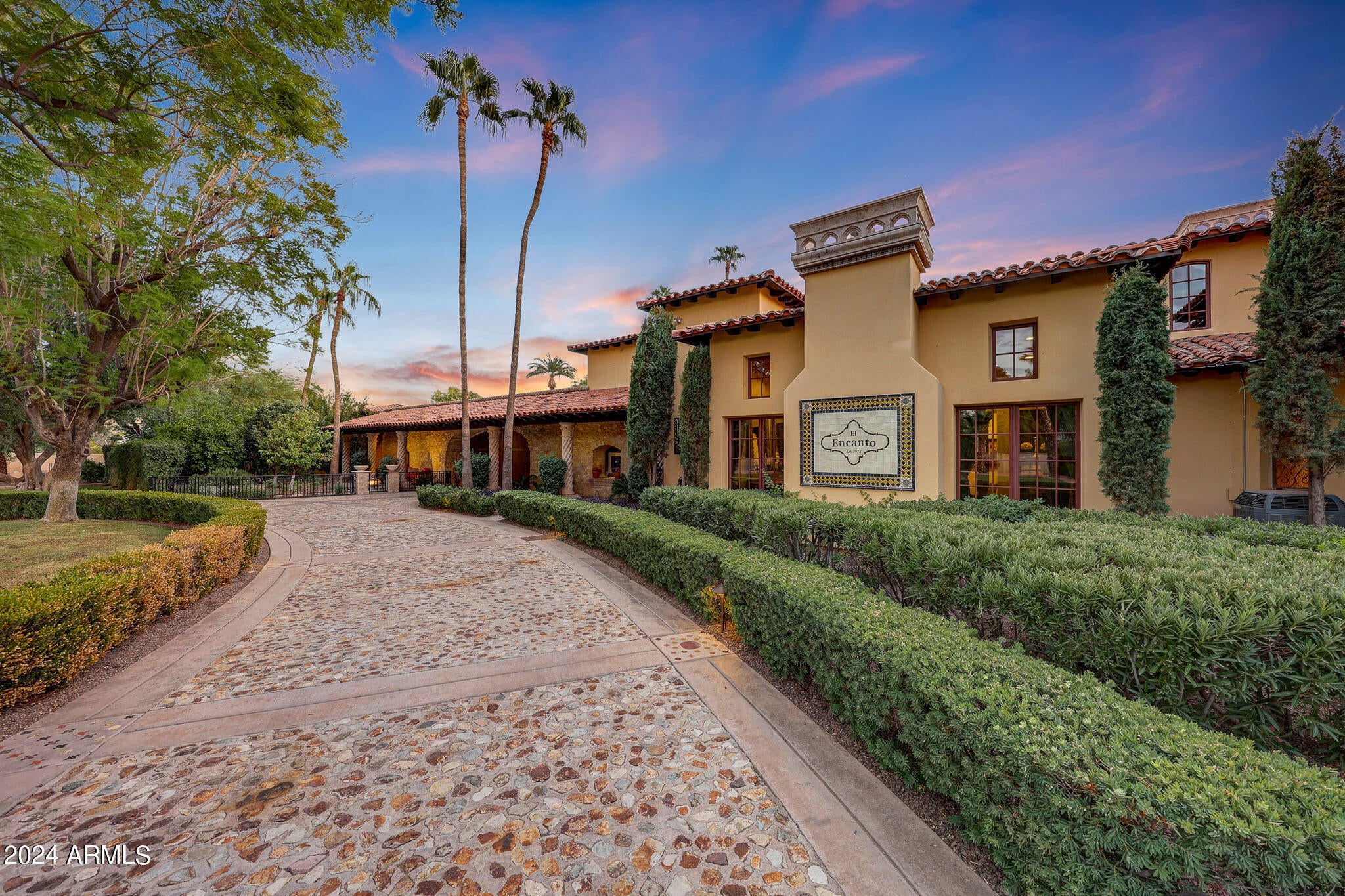 Exceptional Estate for Sale in Guard-Gated Equestrian Manor, Scottsdale



Step into a realm of timeless elegance with this breathtaking French provincial estate, nestled on a sprawling 1.6-acre lot in the exclusive guard-gated community of Equestrian Manor. This remarkable residence exudes sophistication and charm, making it a true forever home.

Spanning an impressive 13,700 square feet, the estate features 7 luxurious bedrooms and 10 meticulously designed bathrooms. Step into a culinary paradise designed for both functionality and flair. This expansive chef's kitchen is a true entertainer's dream, featuring an abundance of workspace and top-of-the-line appliances that will inspire your inner gourmet. Host unforgettable gatherings in the resort-style outdoor kitchen, complete with a stunning diving pool surrounded by manicured grounds and lush landscaping. The tennis court adds to the recreational amenities, ensuring endless fun for all ages. Inside, experience the allure of wood-beamed and domed ceilings, along with 11 grand fireplaces that serve as stunning focal points. The hand-carved wood accents and stone walls add a touch of artisanal craftsmanship throughout the home. Enjoy cinematic experiences in the dedicated movie theater, featuring an impressive 167-inch screen. The game room promises endless entertainment options for family and friends. The exquisite wine room is perfect for connoisseurs, while the office/library provides a serene space for work or relaxation. Marvel at the custom iron work that adorns the estate, from the elegant fence to the striking stairwell and chandeliers, to the Juliette balconies, elevating the home's aesthetic to new heights. A spacious 8-car motor court offers ample room for your collection of vehicles. This estate is not just a home; it's a sanctuary of style, comfort, and grandeur, inviting you to create lasting memories in an unparalleled setting. Don't miss the opportunity to own this exceptional property in one of Scottsdale's most sought-after communities.